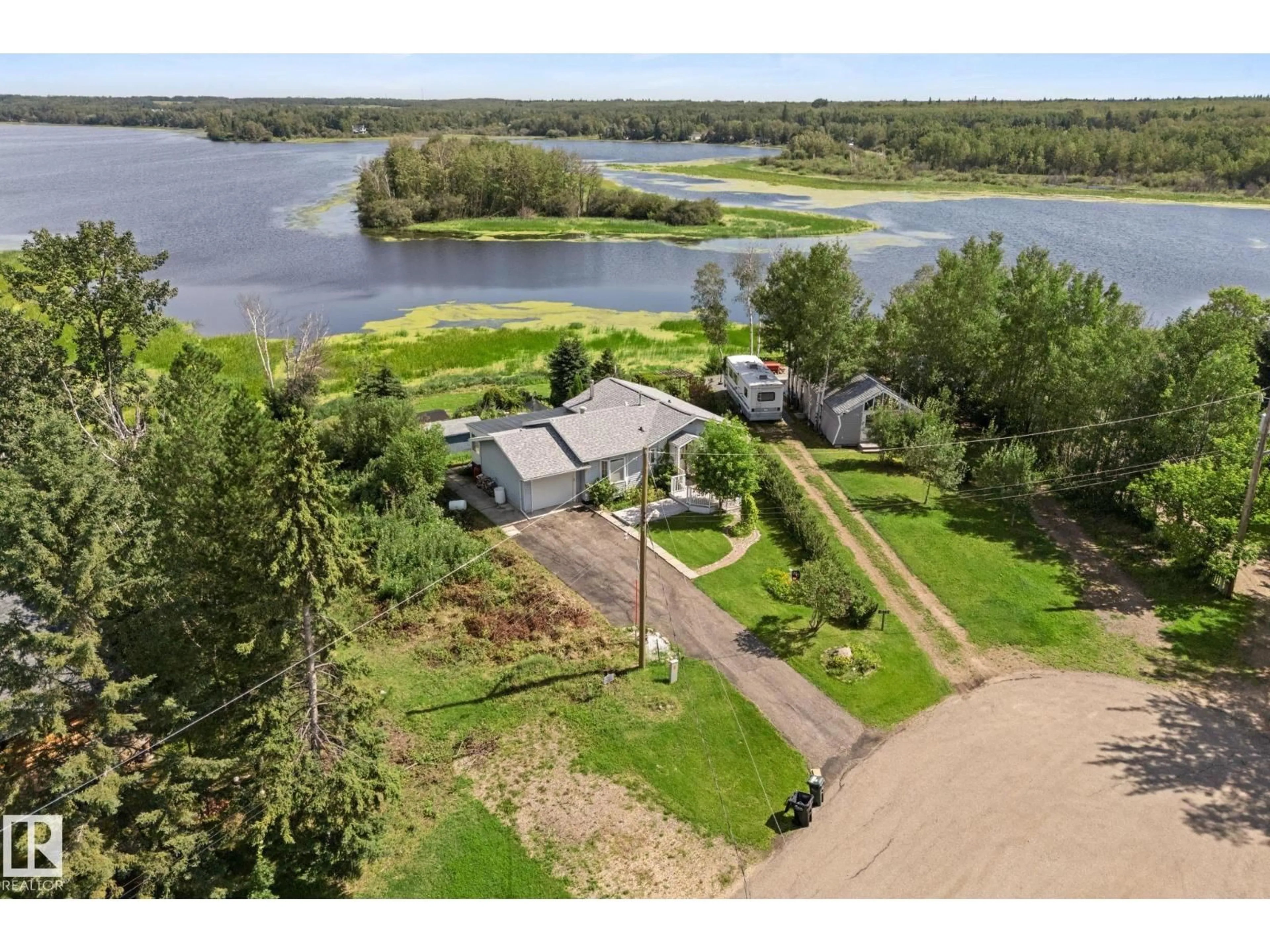 A pic from outside/outdoor area/front of a property/back of a property/a pic from drone, water/lake/river/ocean view for 52343 - 274 RGE ROAD 211, Rural Strathcona County Alberta T8G1A6