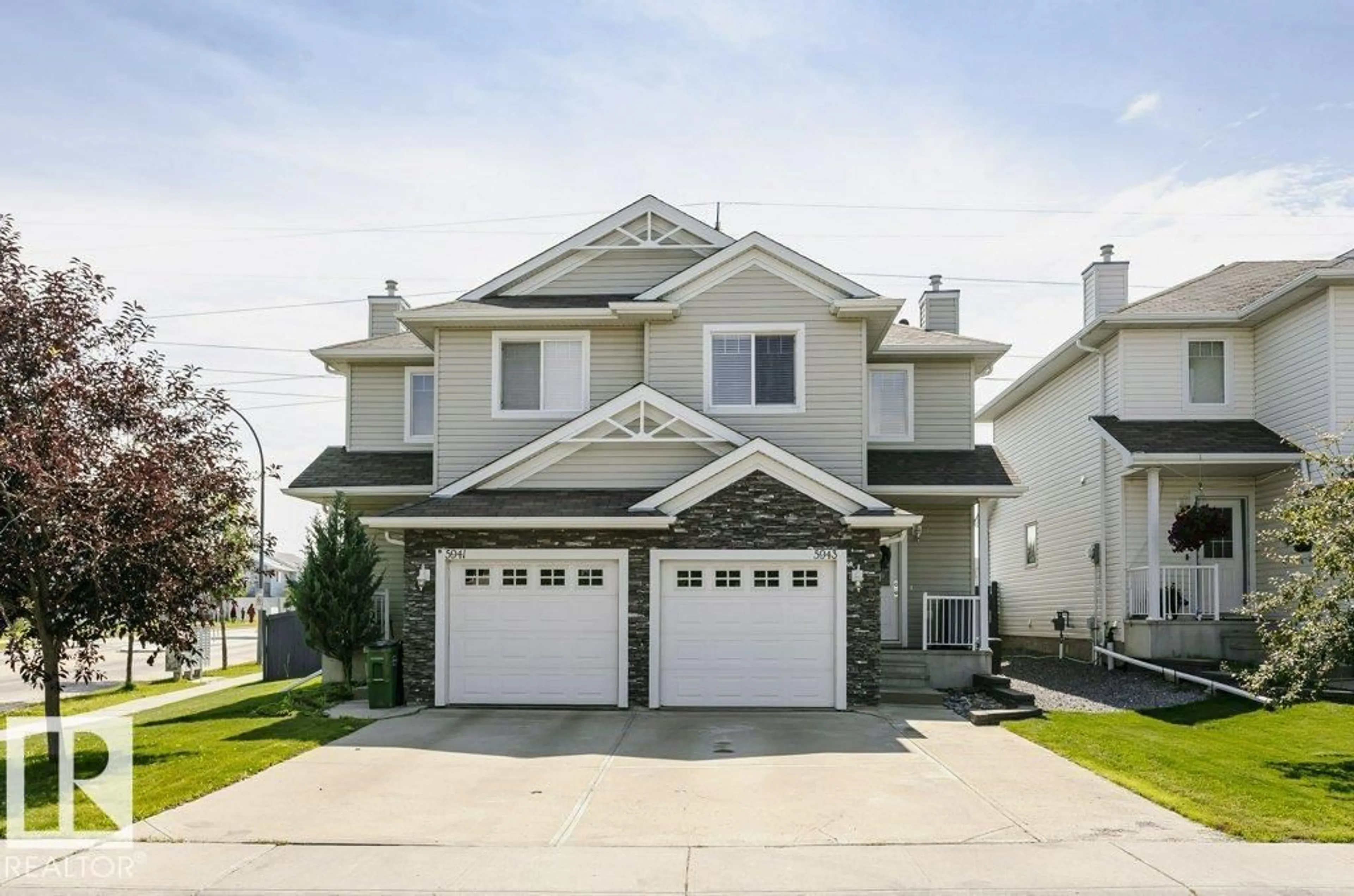 Home with vinyl exterior material, street for 5943 164 AV, Edmonton Alberta T5Y0B2