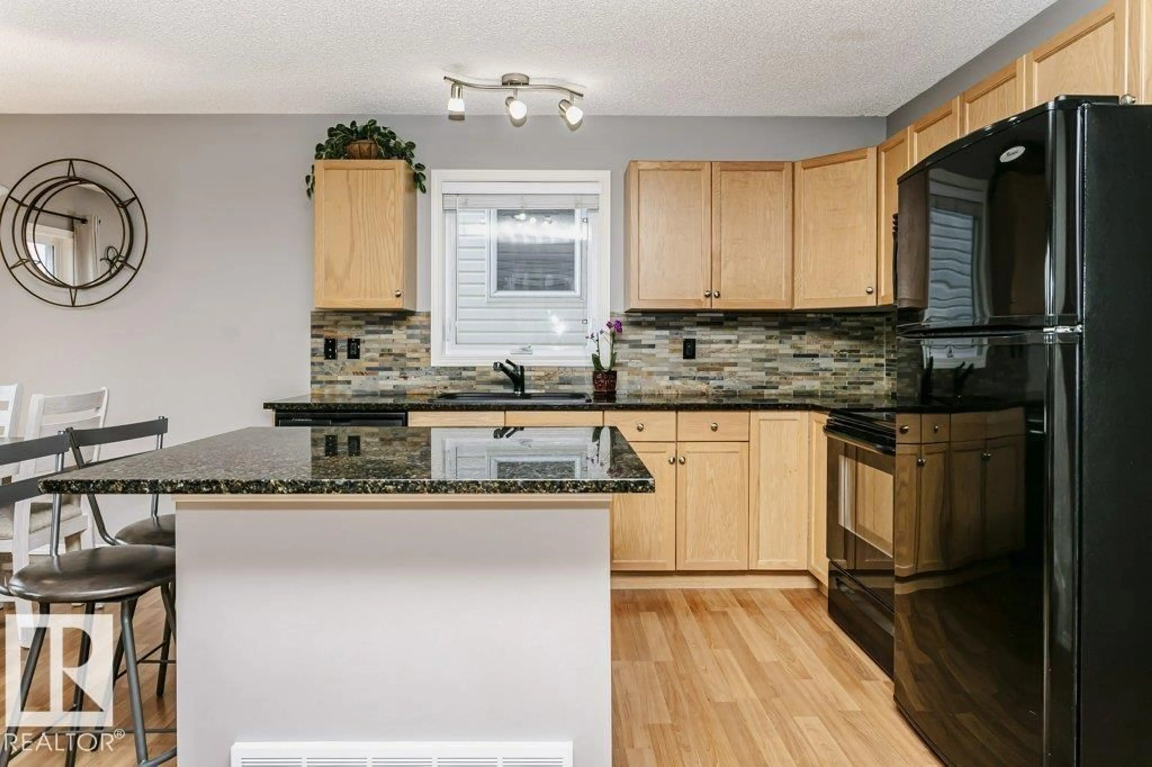 Open concept kitchen, unknown for 5943 164 AV, Edmonton Alberta T5Y0B2