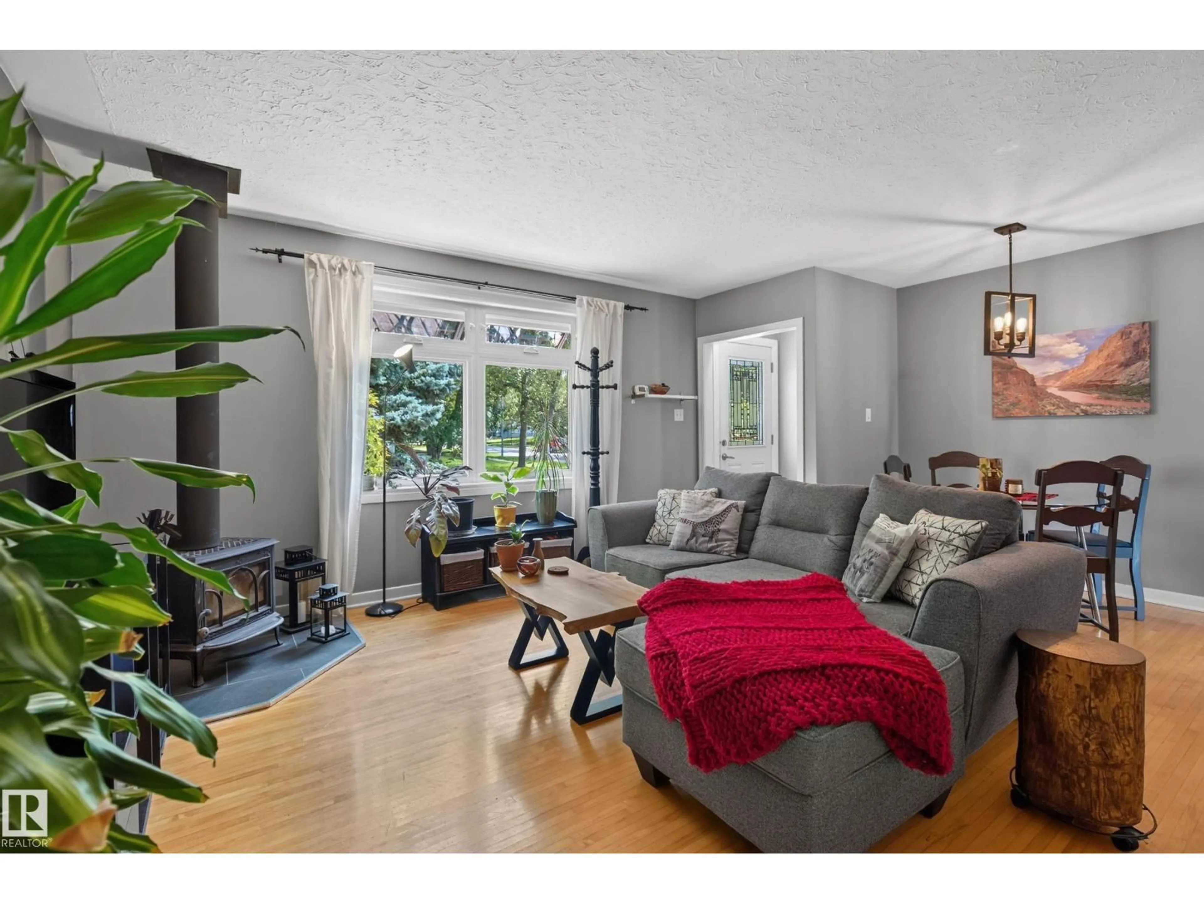 Living room with furniture, wood/laminate floor for 6806 110 ST, Edmonton Alberta T6H3E7