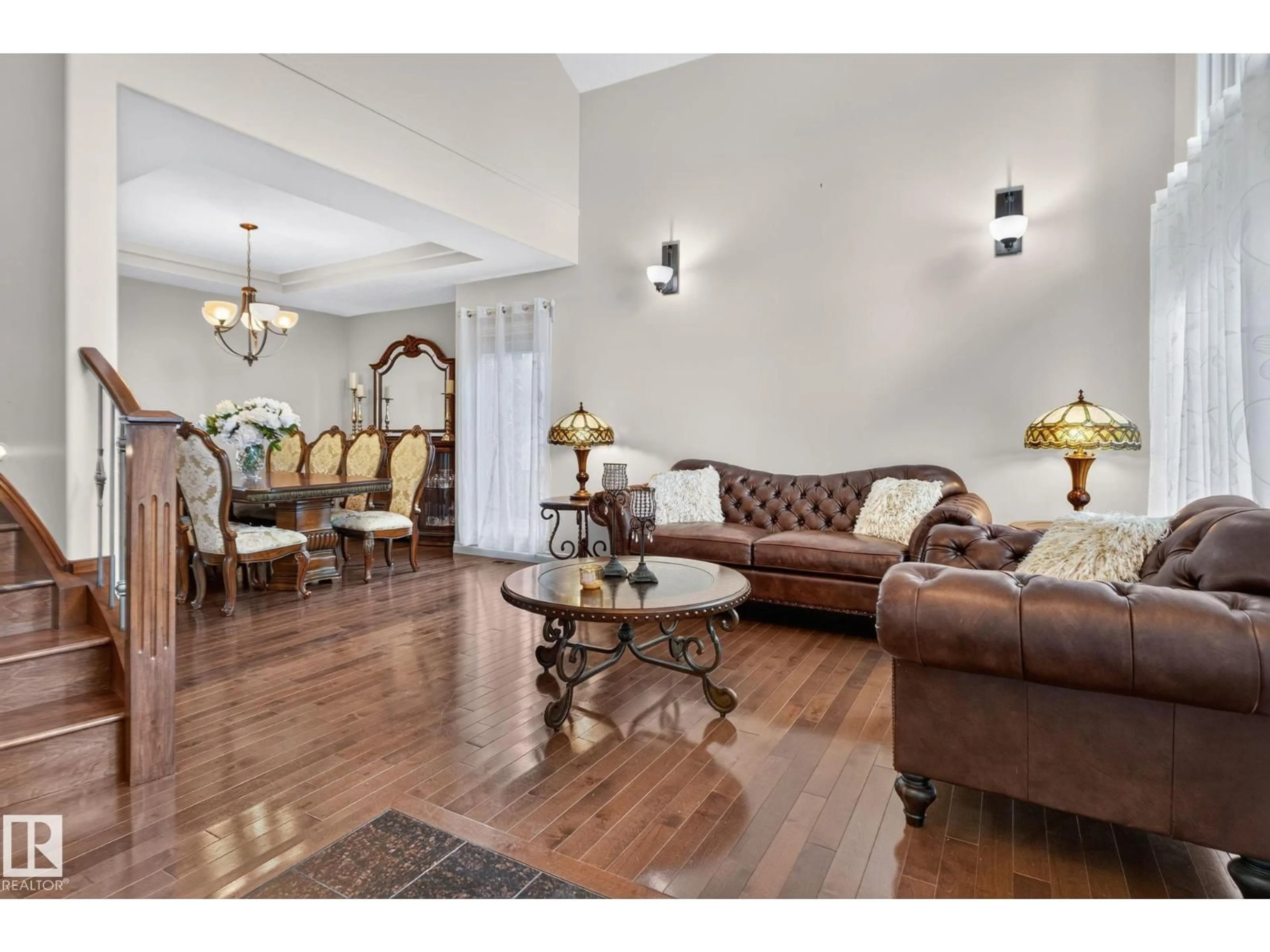Living room with furniture, wood/laminate floor for 2489 MARTELL CR, Edmonton Alberta T6R0M7