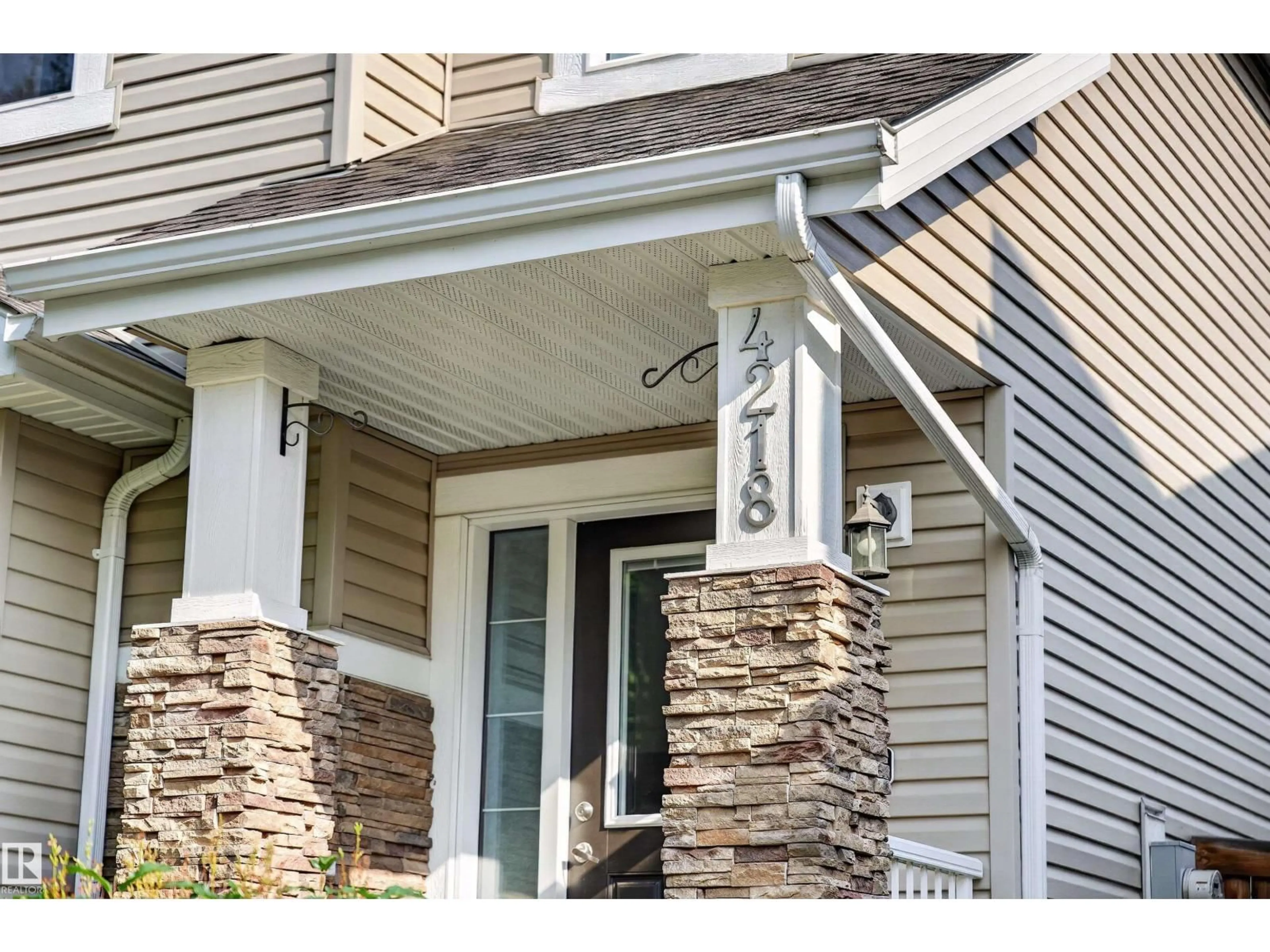 Home with vinyl exterior material, street for 4218 ALEXANDER BAY SW, Edmonton Alberta T6W2C8