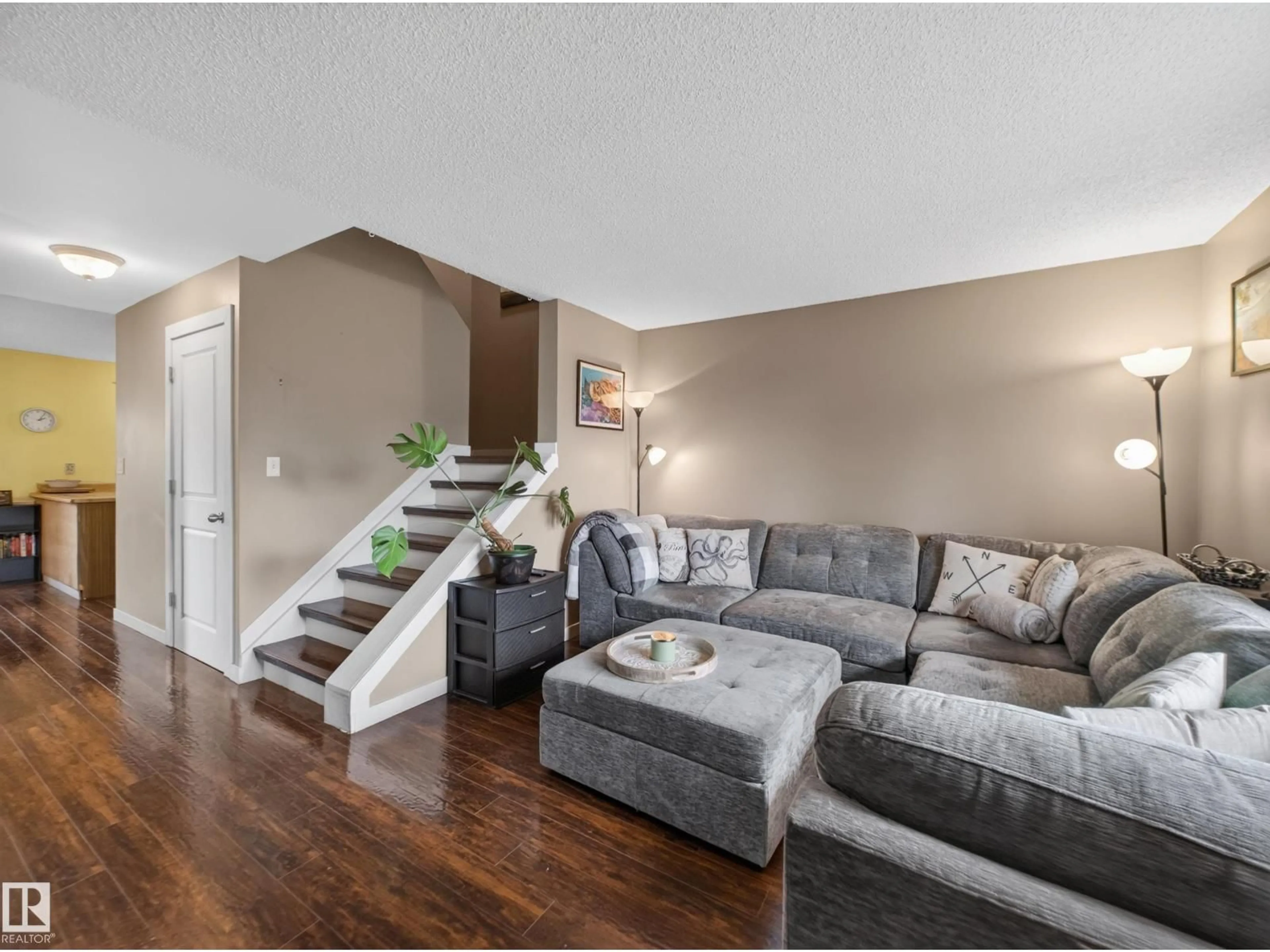 Living room with furniture, wood/laminate floor for NW - 3503 42A AV, Edmonton Alberta T6L4C6