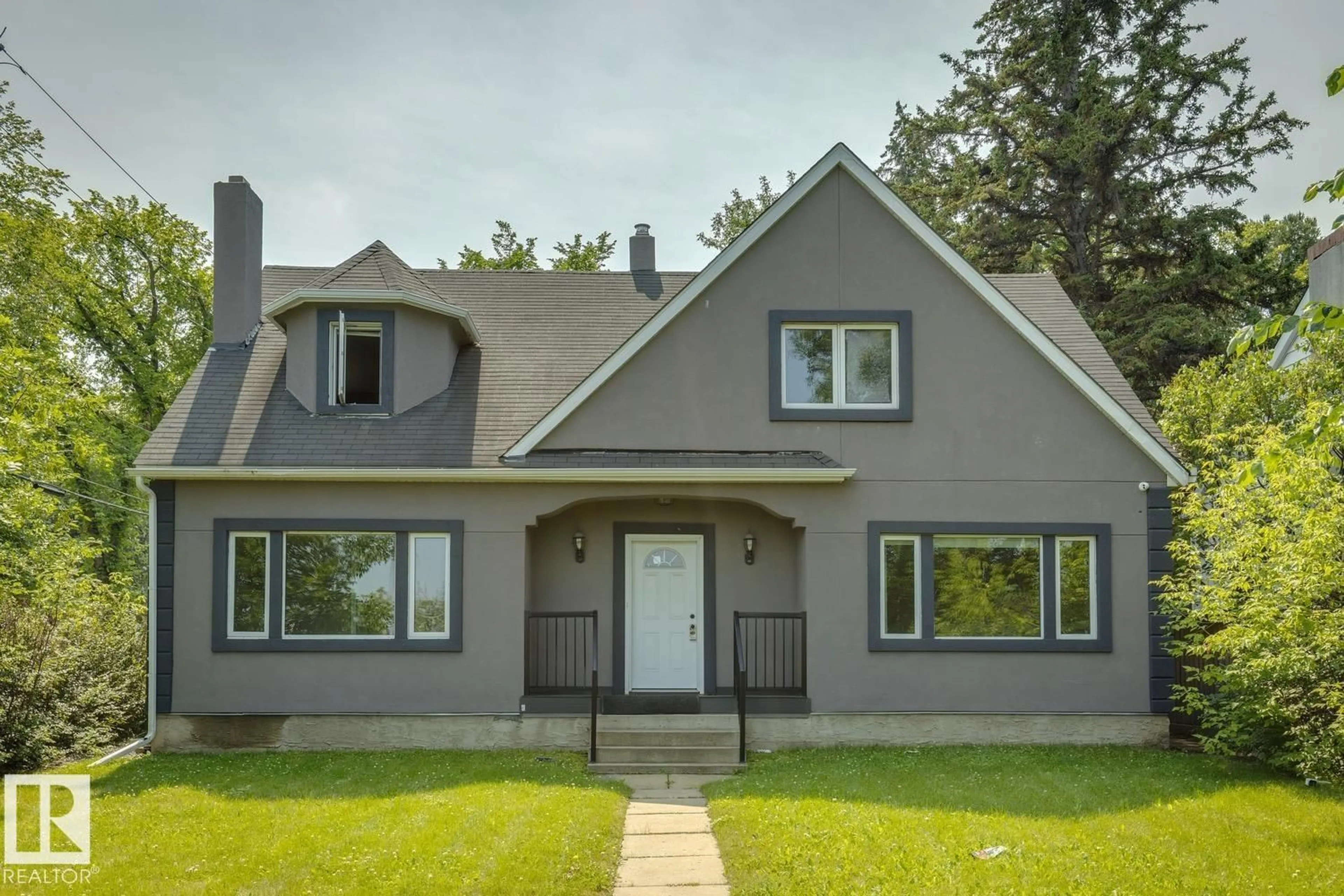 Home with vinyl exterior material, street for 11603 SASKATCHEWAN DR, Edmonton Alberta T6G2B5