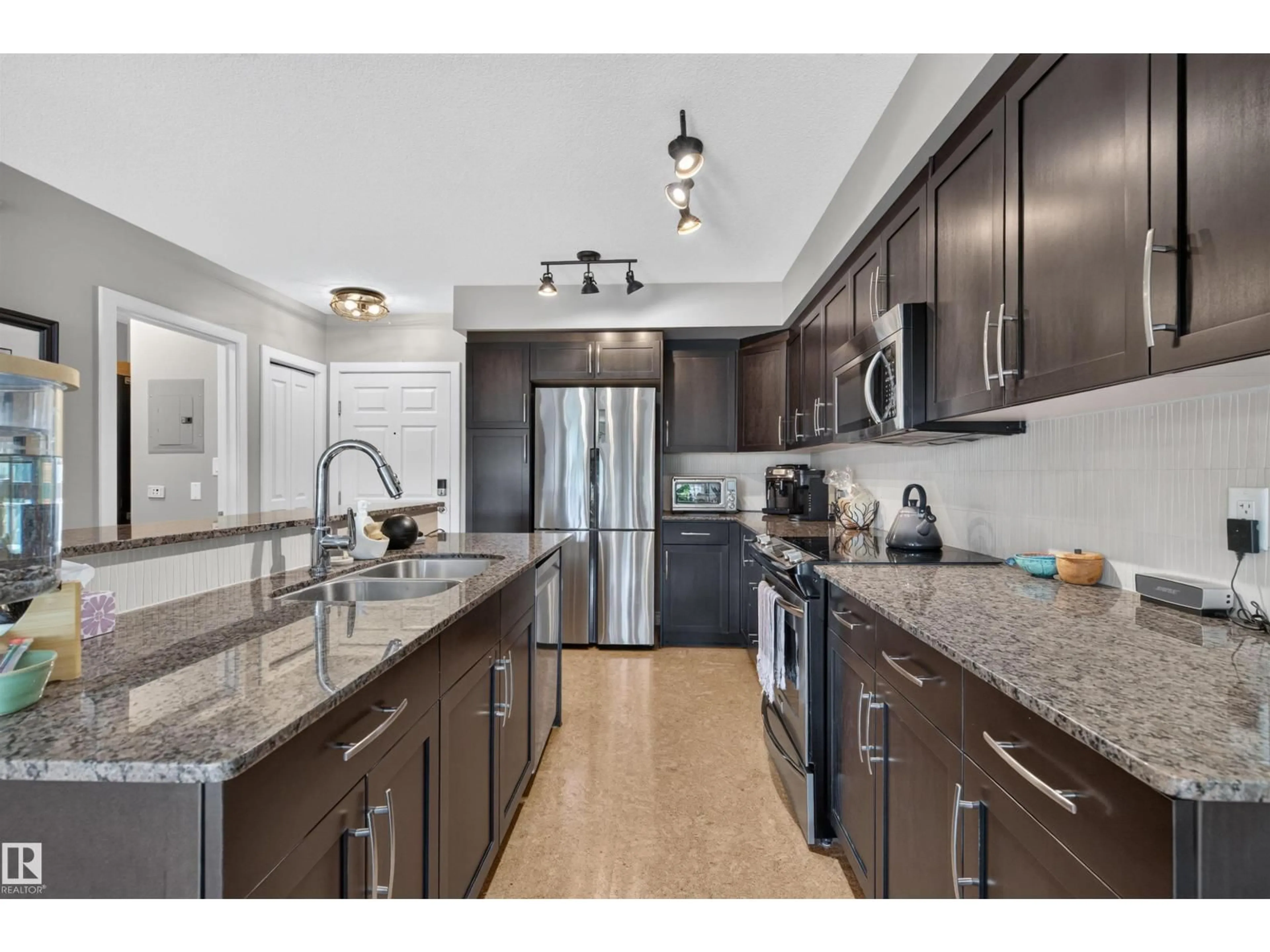 Open concept kitchen, unknown for #301 - 9603 98 AV, Edmonton Alberta T6C2E2