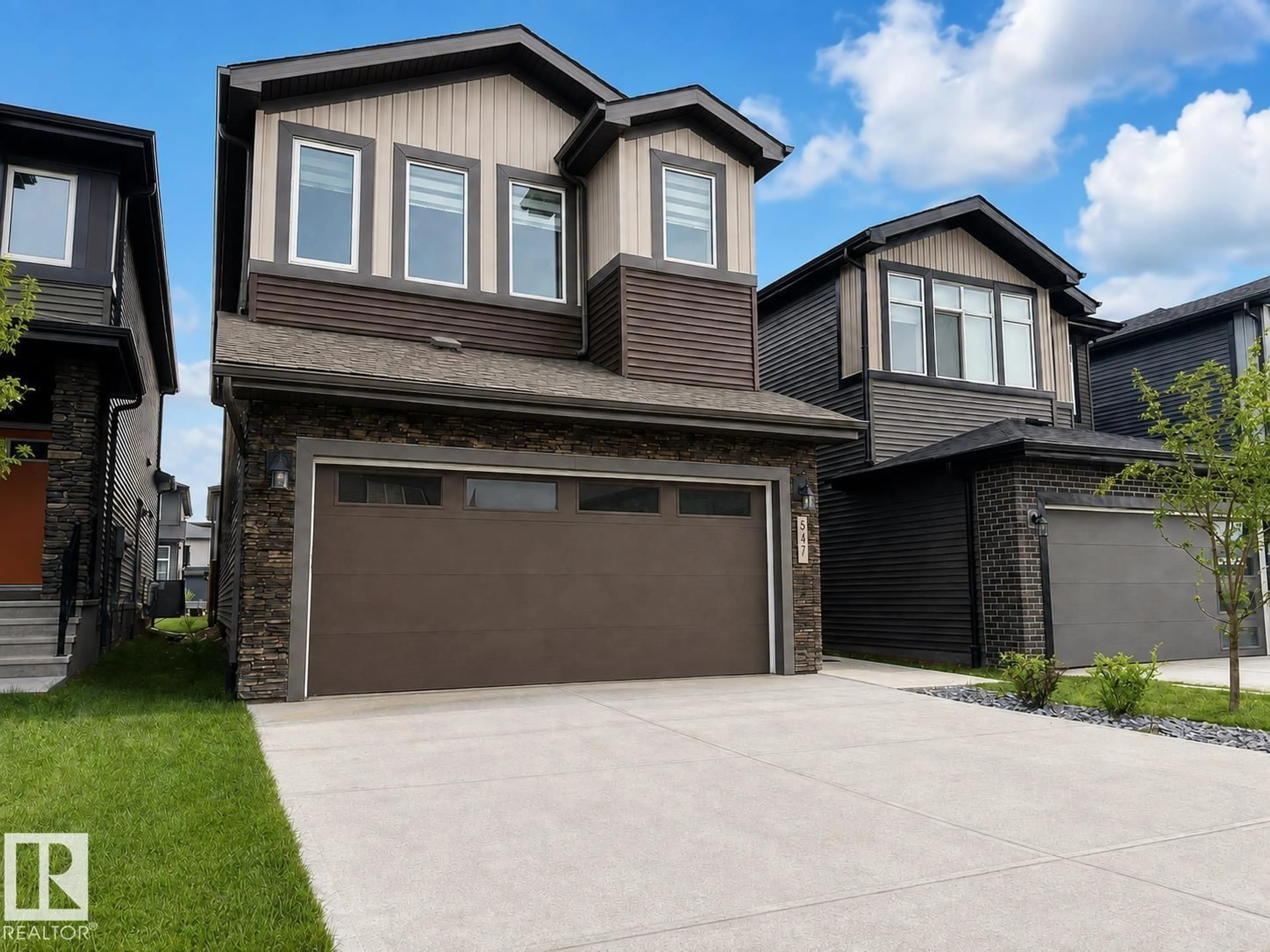 Home with vinyl exterior material, street for 5478 KOOTOOK RD, Edmonton Alberta T6W2Z5
