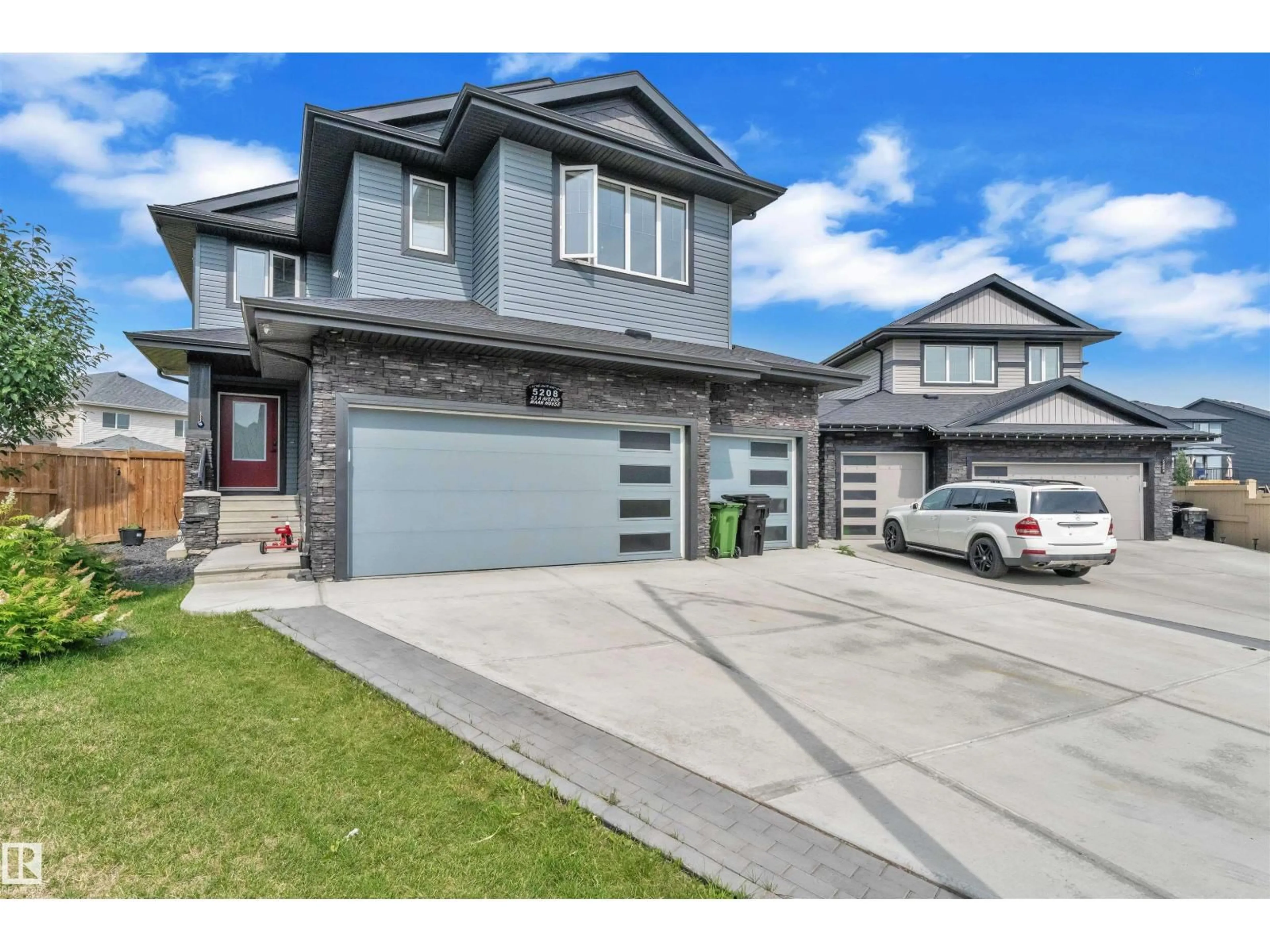 Home with vinyl exterior material, street for SW - 5208 23A AV, Edmonton Alberta T6X2X3