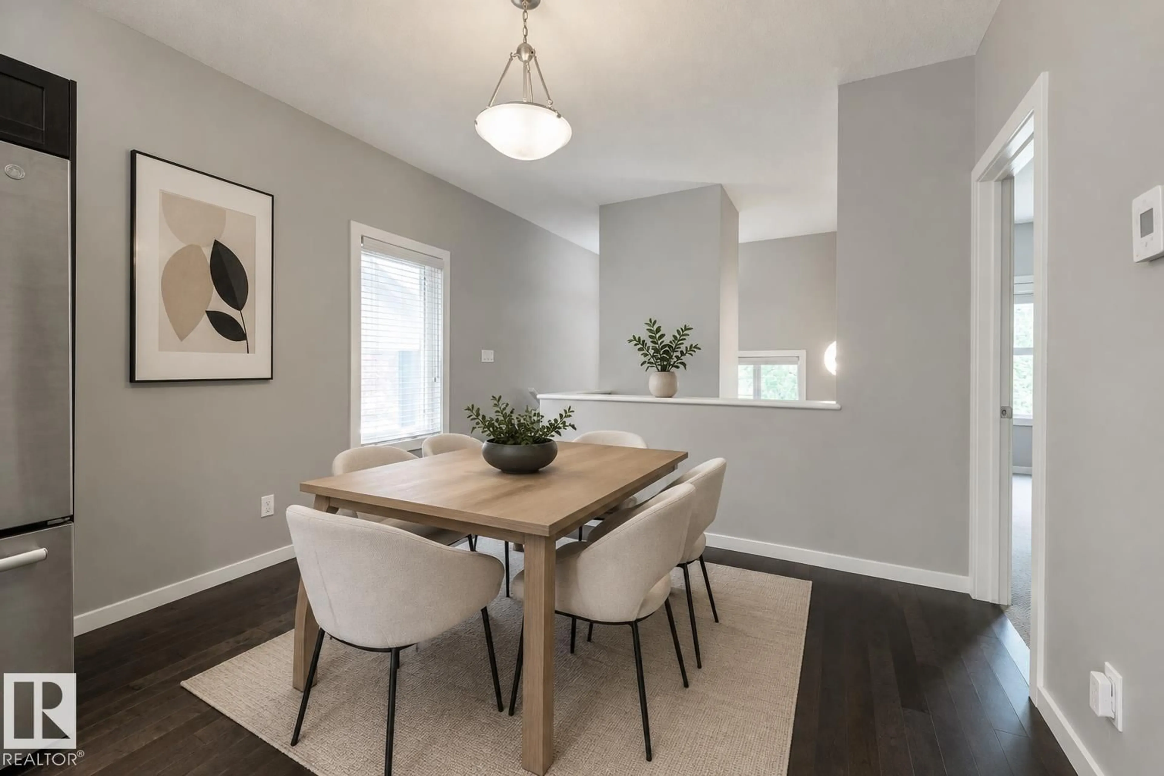 Dining room, wood/laminate floor for 7058 CARDINAL WY, Edmonton Alberta T6W1Z2
