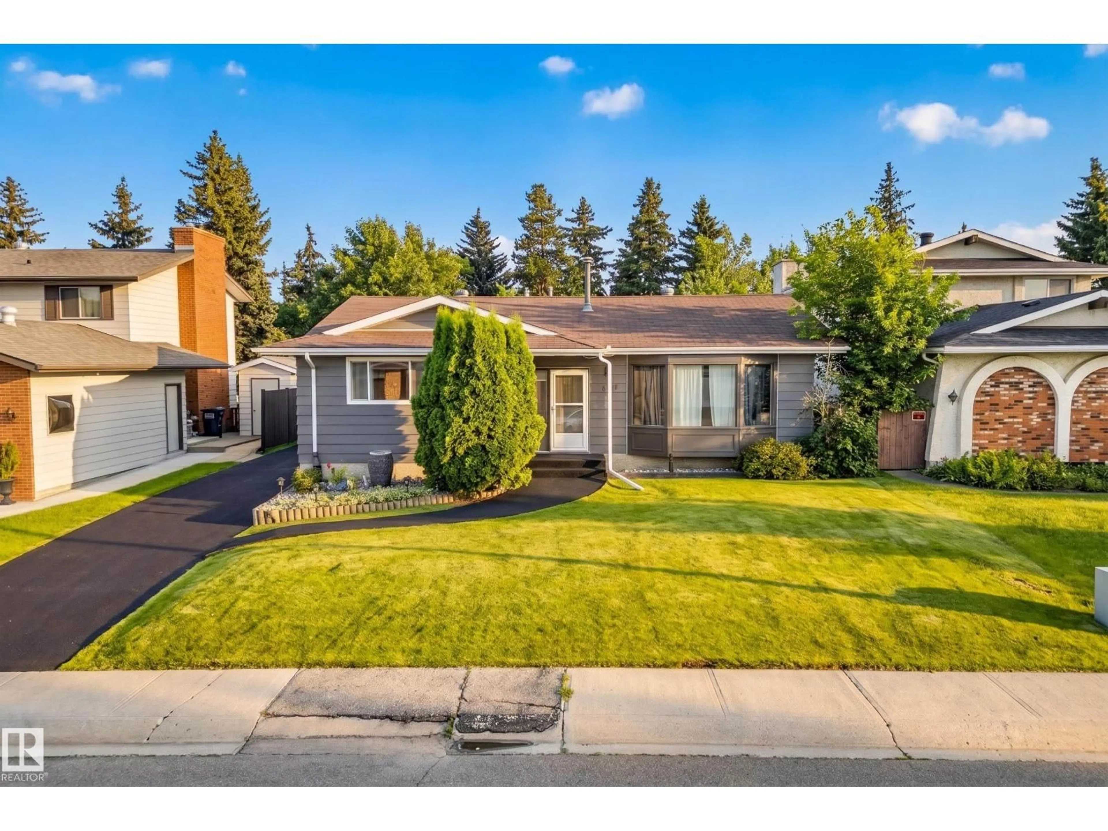 Home with vinyl exterior material, street for NW - 11727 27 AV, Edmonton Alberta T6J3N7