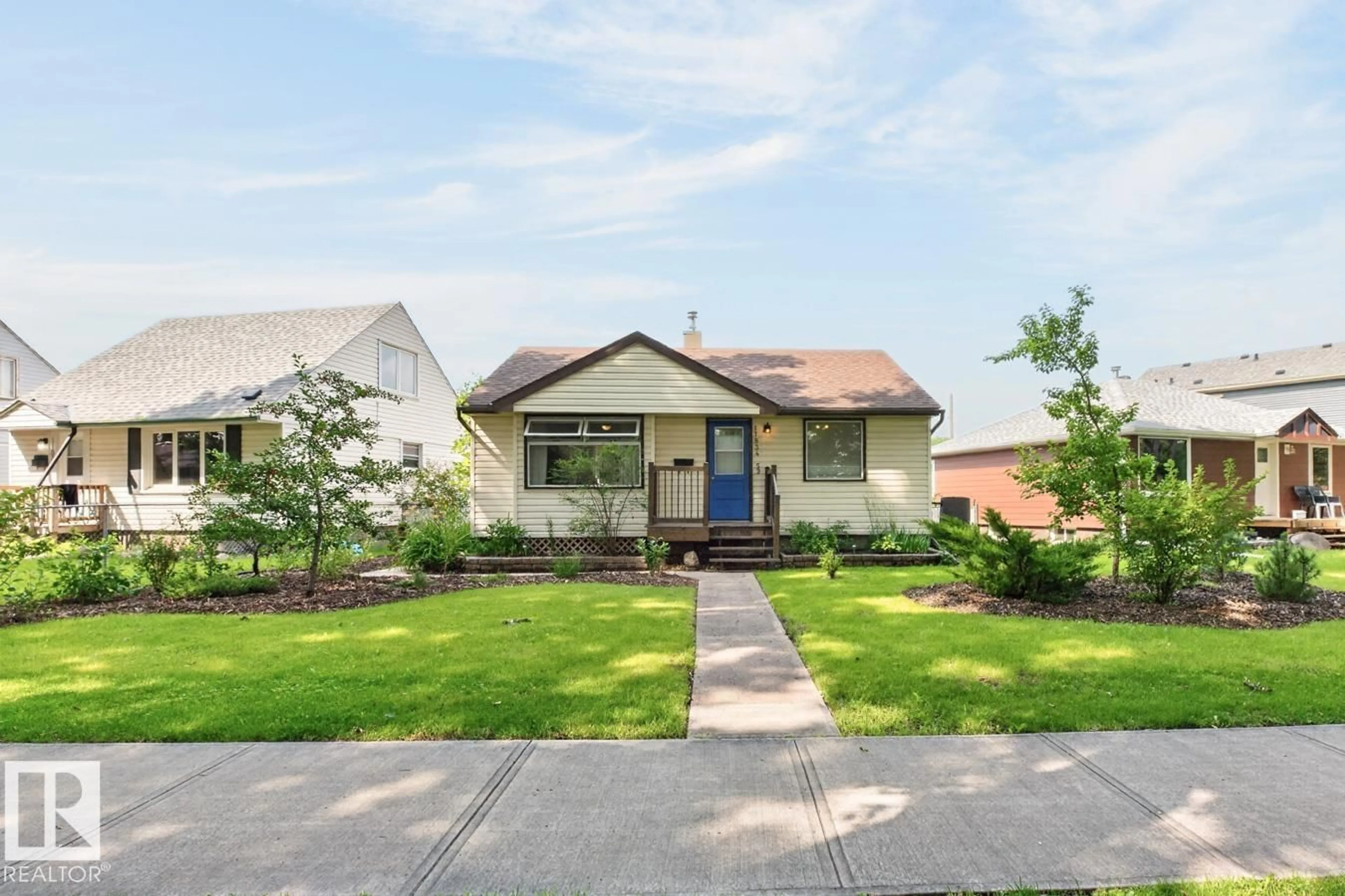Home with vinyl exterior material, street for 11834 59 ST, Edmonton Alberta T5W3X7
