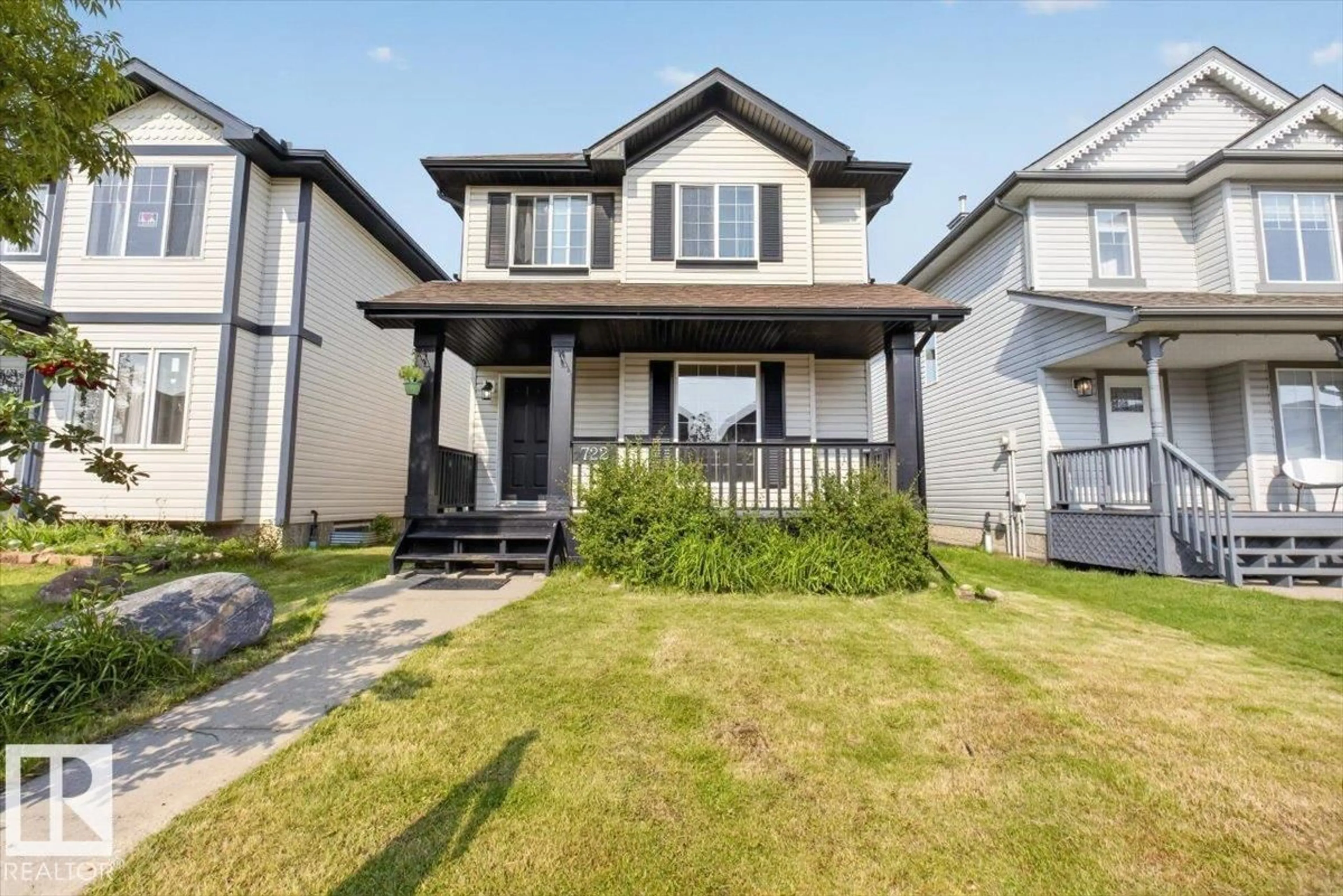 Home with vinyl exterior material, street for 722 88A ST, Edmonton Alberta T6X1C4
