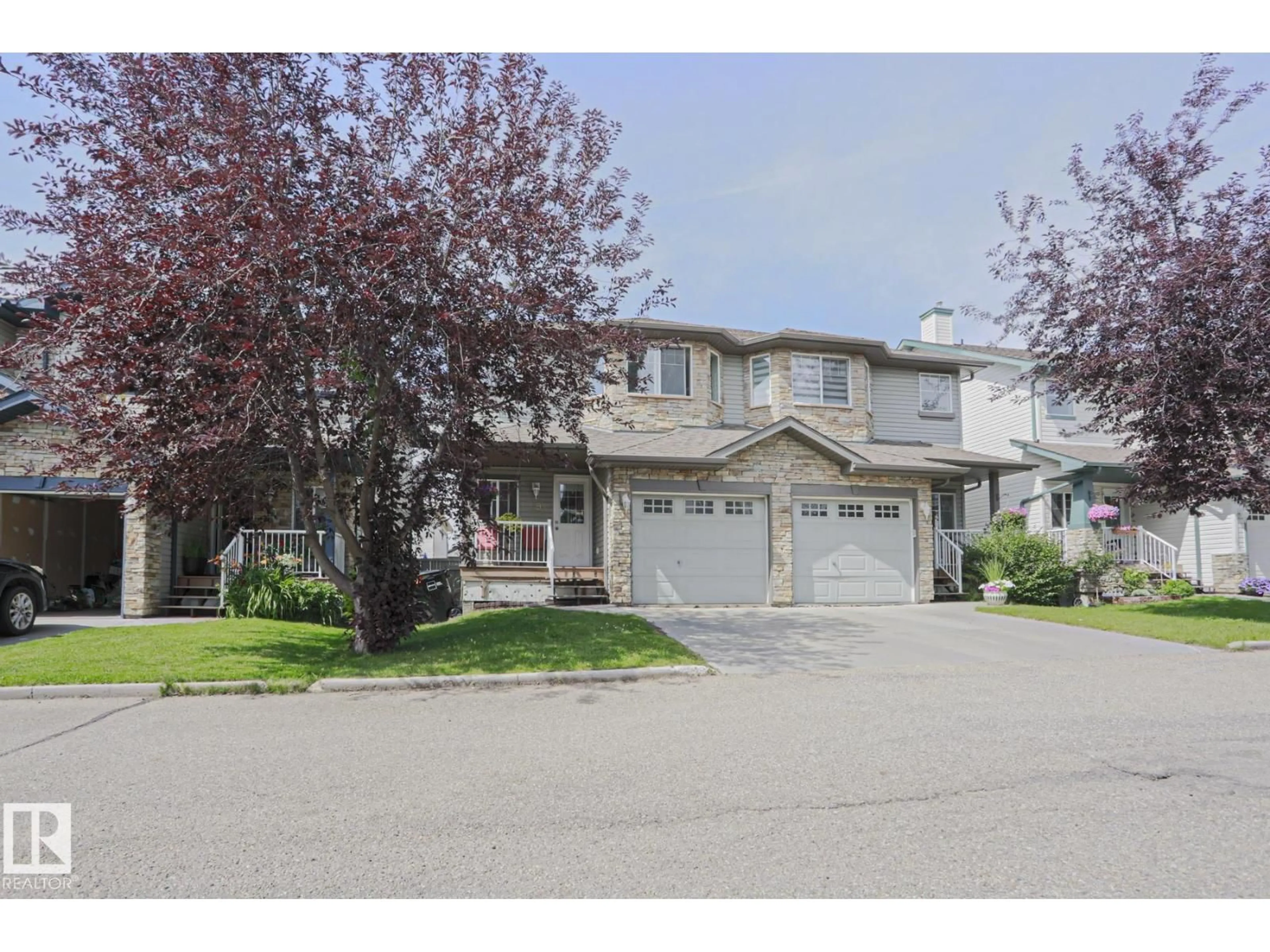 Home with vinyl exterior material, street for 6304 - 49 SANDIN WY, Edmonton Alberta T6R0J8