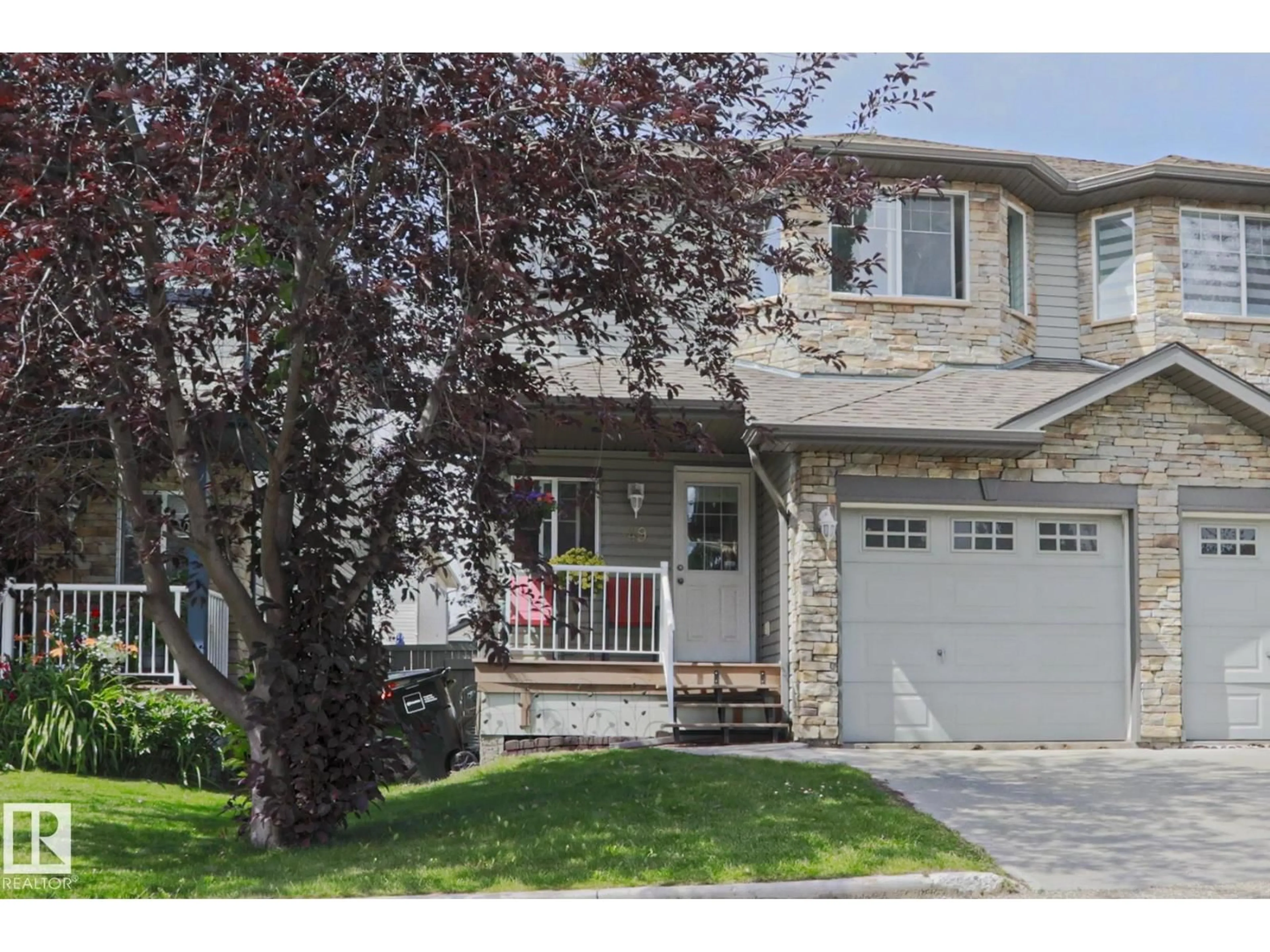 Home with vinyl exterior material, street for 6304 - 49 SANDIN WY, Edmonton Alberta T6R0J8