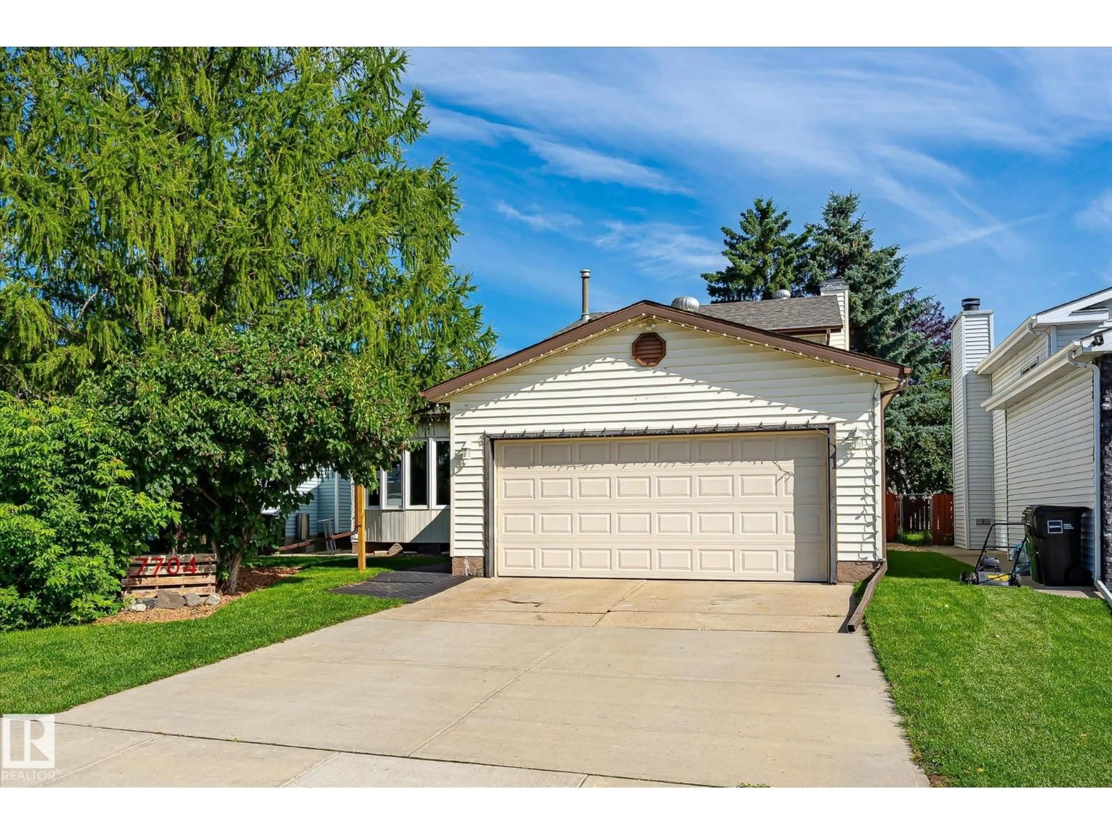 Home with vinyl exterior material, street for NW - 7704 152B AV, Edmonton Alberta T5C3M5