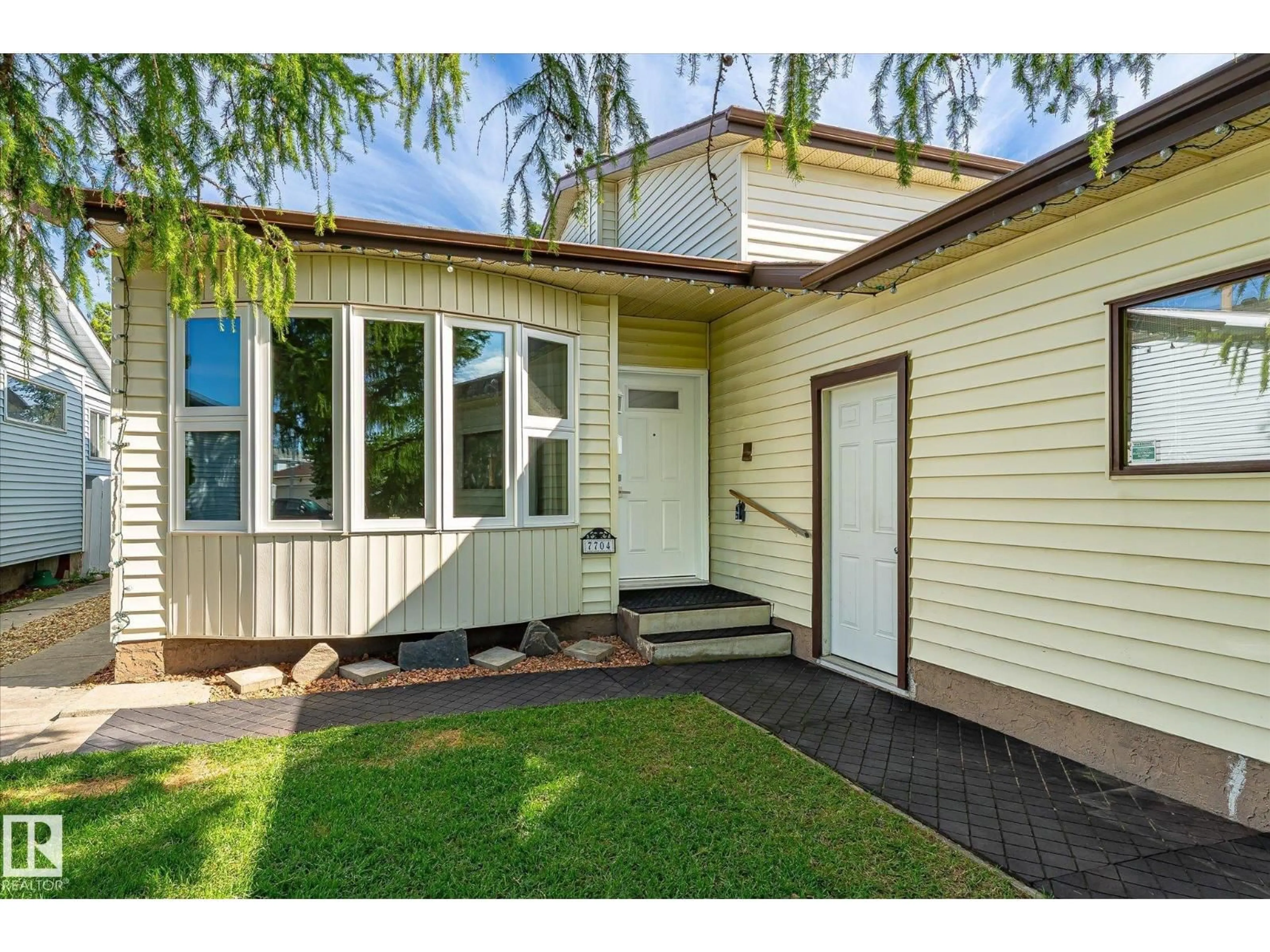 Home with vinyl exterior material, street for NW - 7704 152B AV, Edmonton Alberta T5C3M5