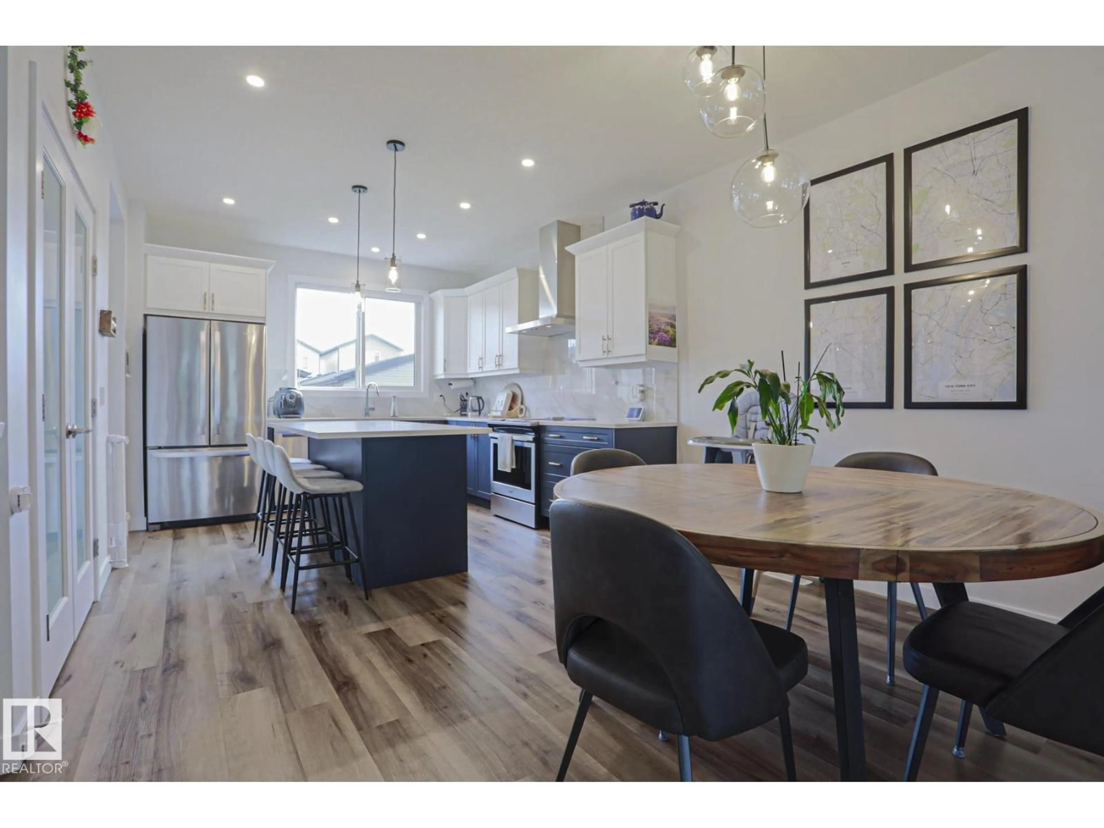 Open concept kitchen, wood/laminate floor for 1921 KROETSCH CR, Edmonton Alberta T6W4J2