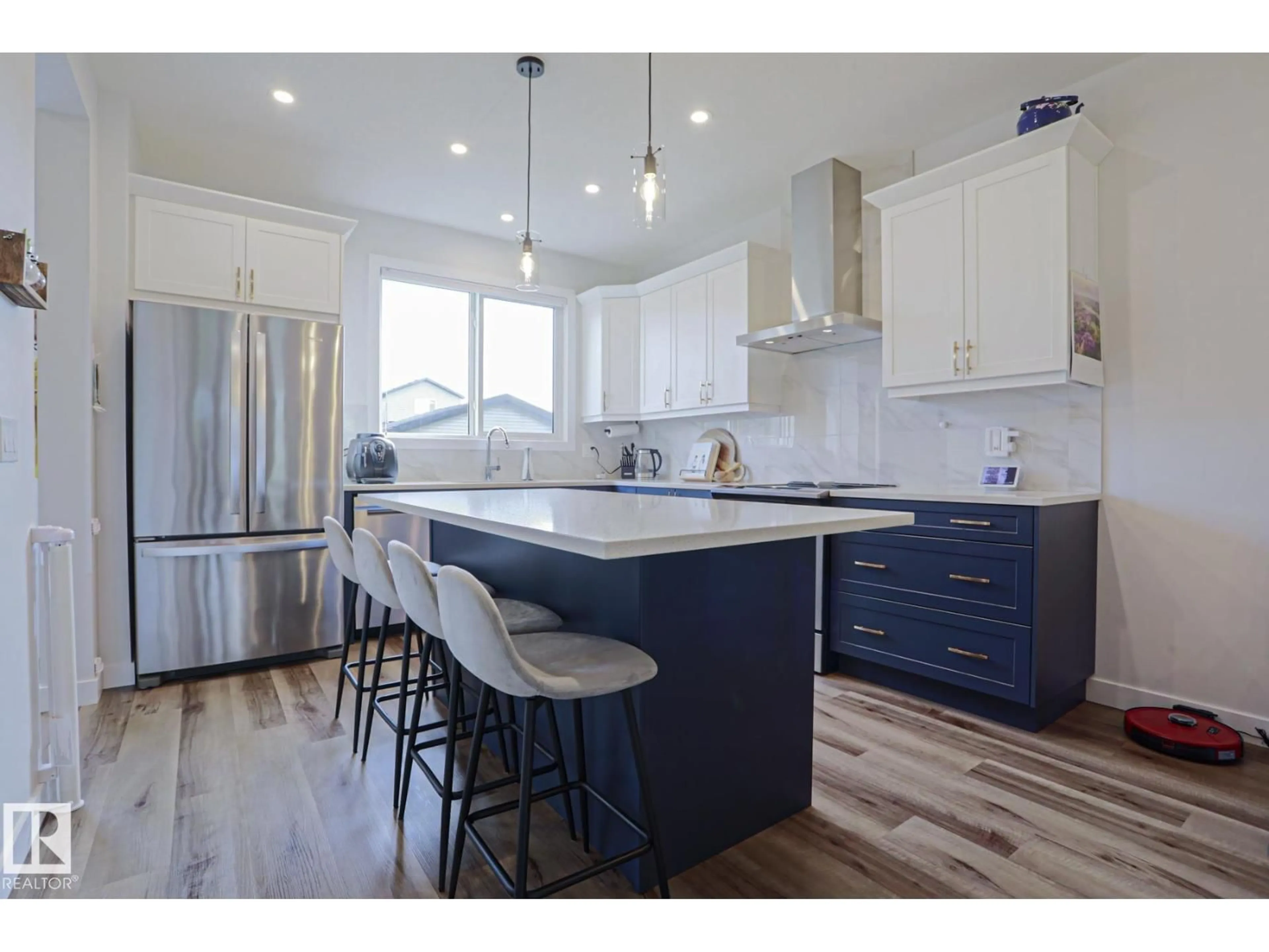 Open concept kitchen, wood/laminate floor for 1921 KROETSCH CR, Edmonton Alberta T6W4J2