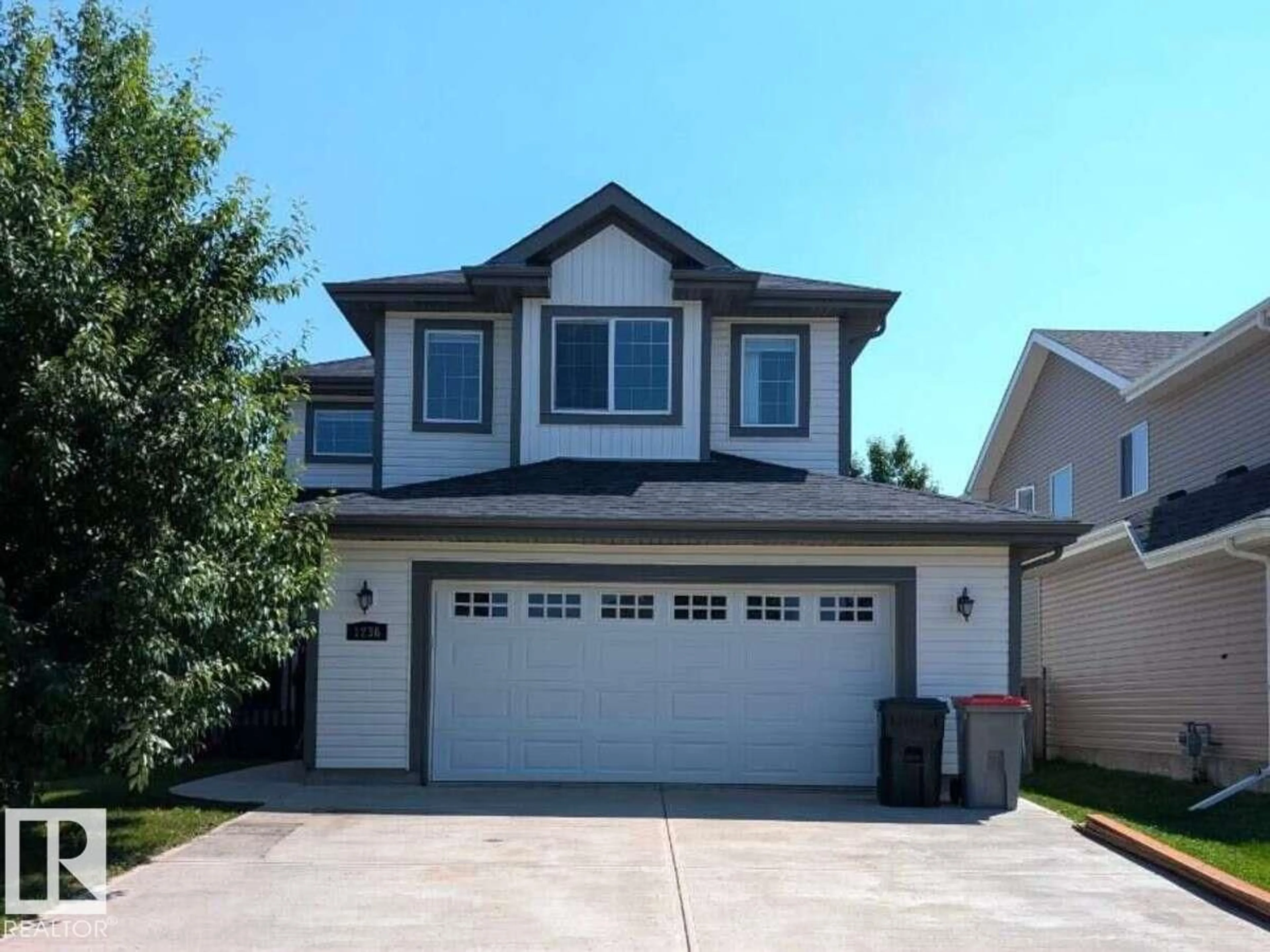 Home with vinyl exterior material, street for 1236 WESTERRA CR, Stony Plain Alberta T7Z0B2