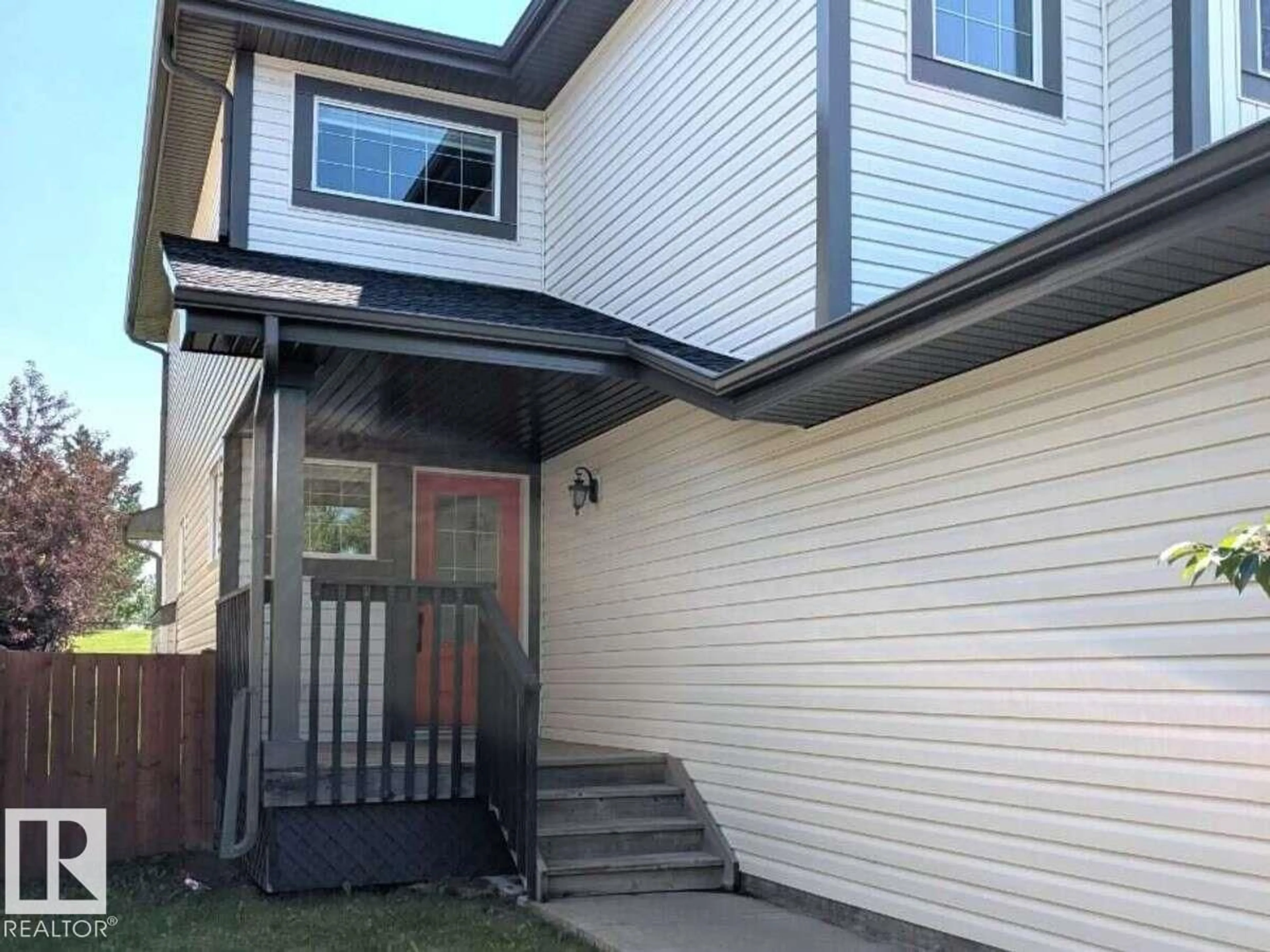 Home with vinyl exterior material, street for 1236 WESTERRA CR, Stony Plain Alberta T7Z0B2