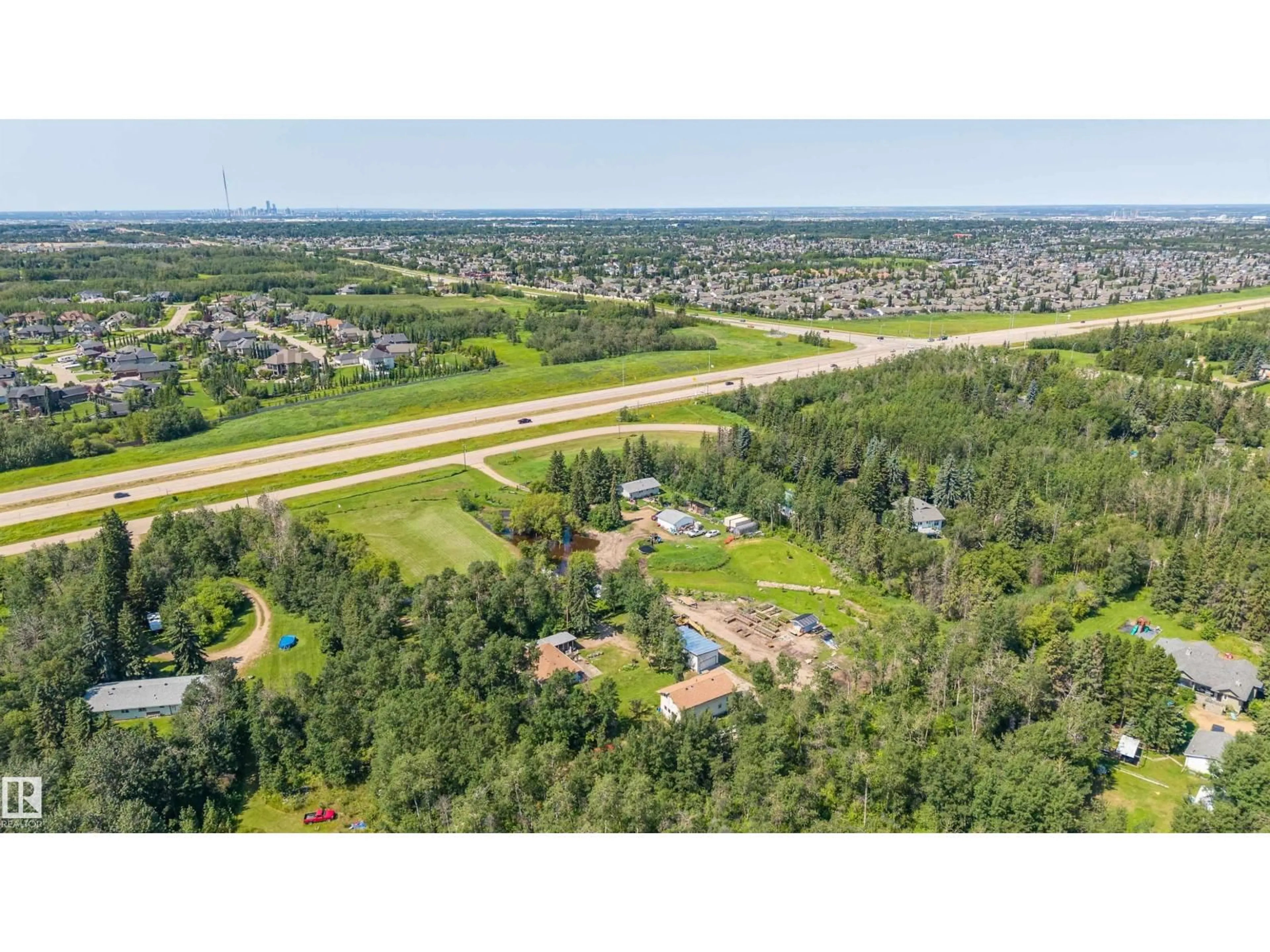 A pic from outside/outdoor area/front of a property/back of a property/a pic from drone, unknown for 22559 - 319 WYE RD, Rural Strathcona County Alberta T8C1H9