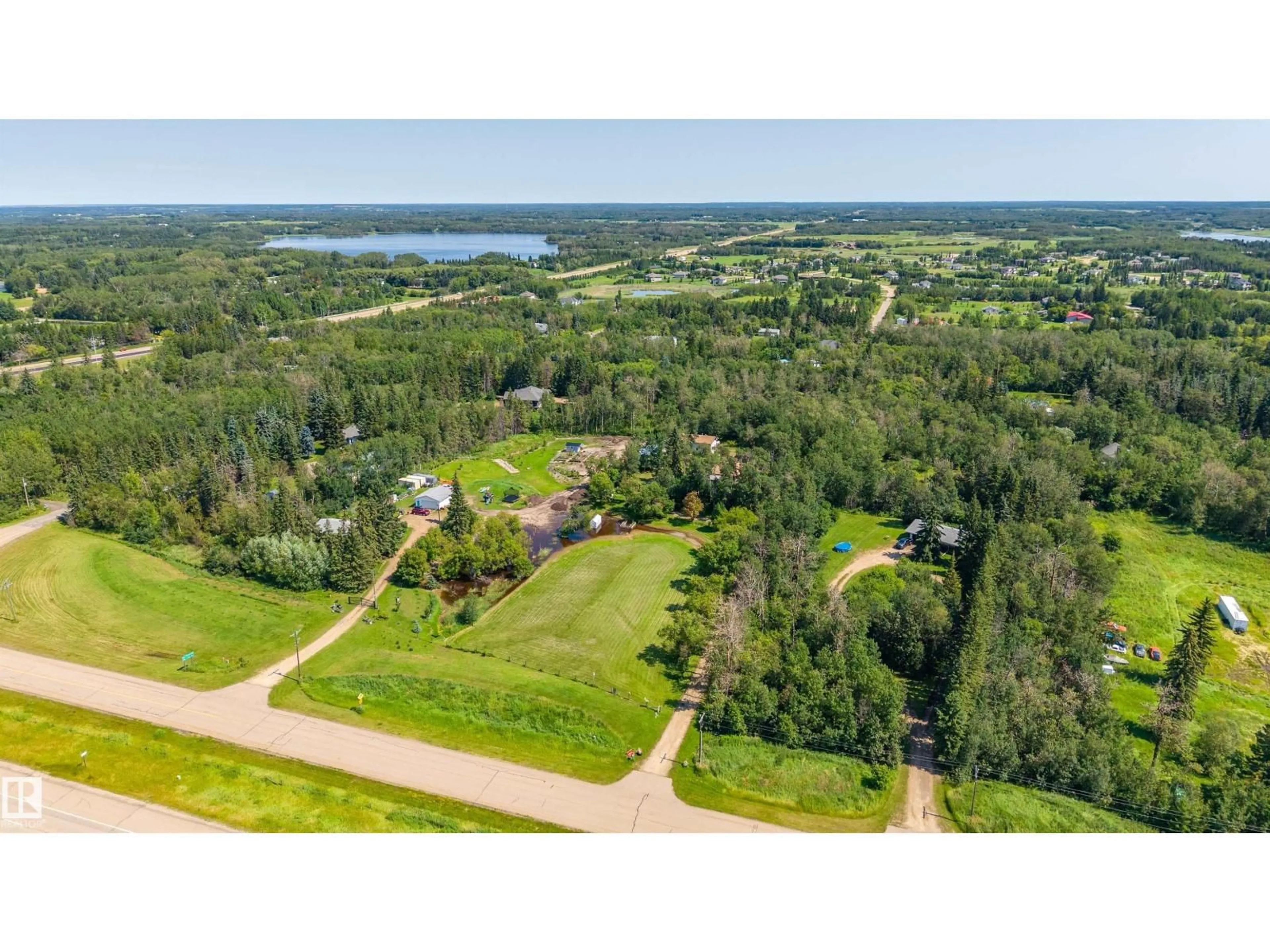 A pic from outside/outdoor area/front of a property/back of a property/a pic from drone, water/lake/river/ocean view for 22559 - 319 WYE RD, Rural Strathcona County Alberta T8C1H9