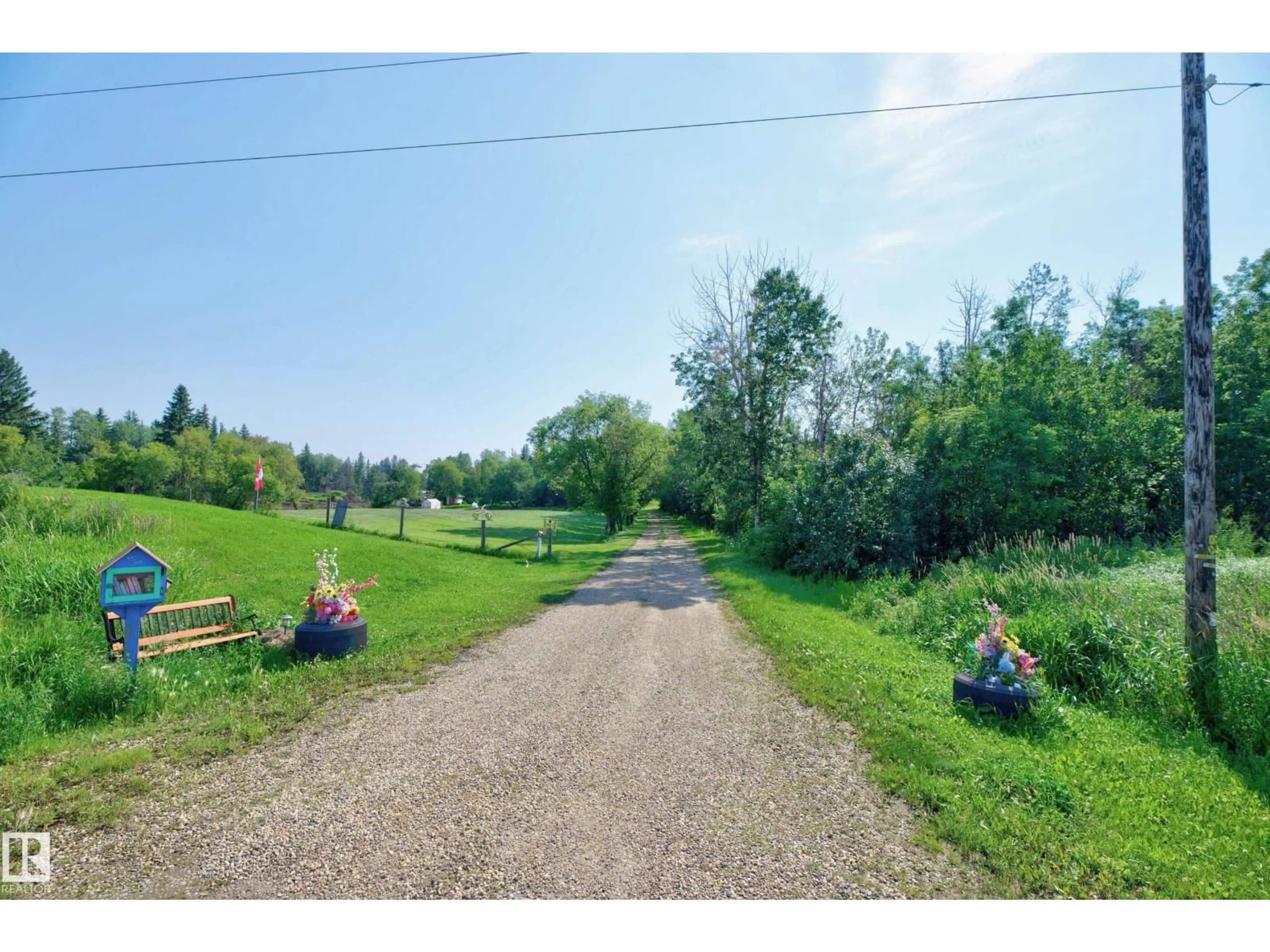 A pic from outside/outdoor area/front of a property/back of a property/a pic from drone, unknown for 22559 - 319 WYE RD, Rural Strathcona County Alberta T8C1H9