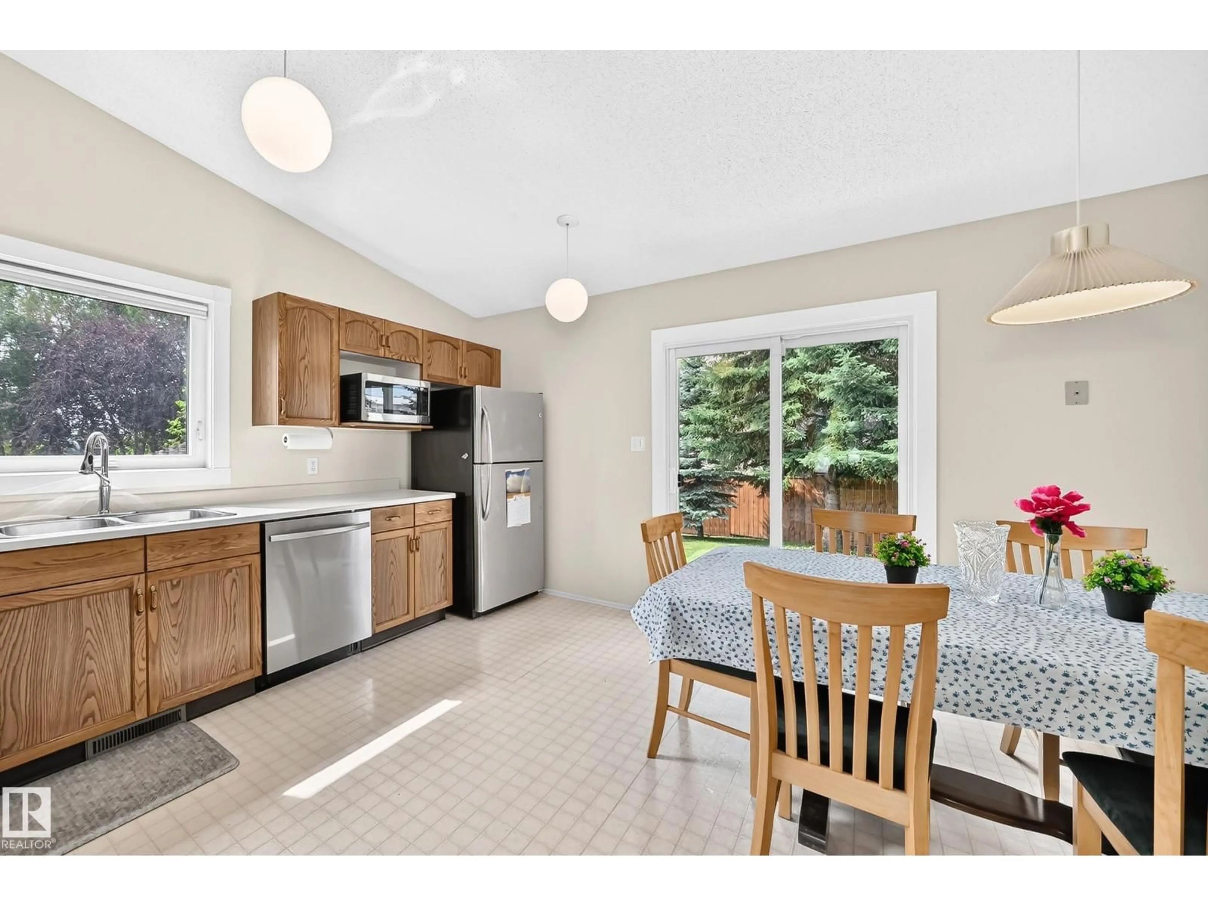 Open concept kitchen, ceramic/tile floor for NW - 2404 37 ST, Edmonton Alberta T6L6E3