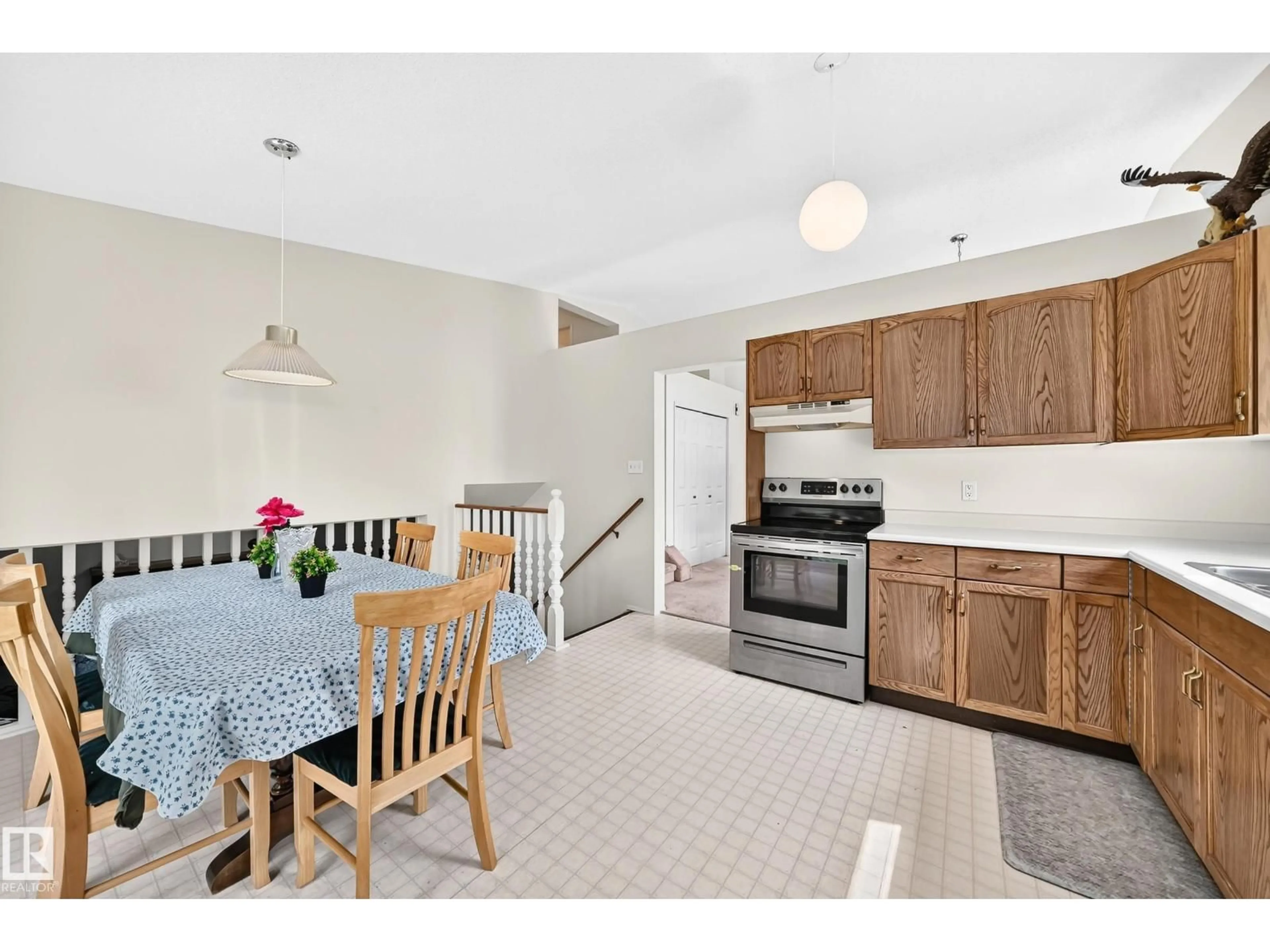 Open concept kitchen, ceramic/tile floor for NW - 2404 37 ST, Edmonton Alberta T6L6E3