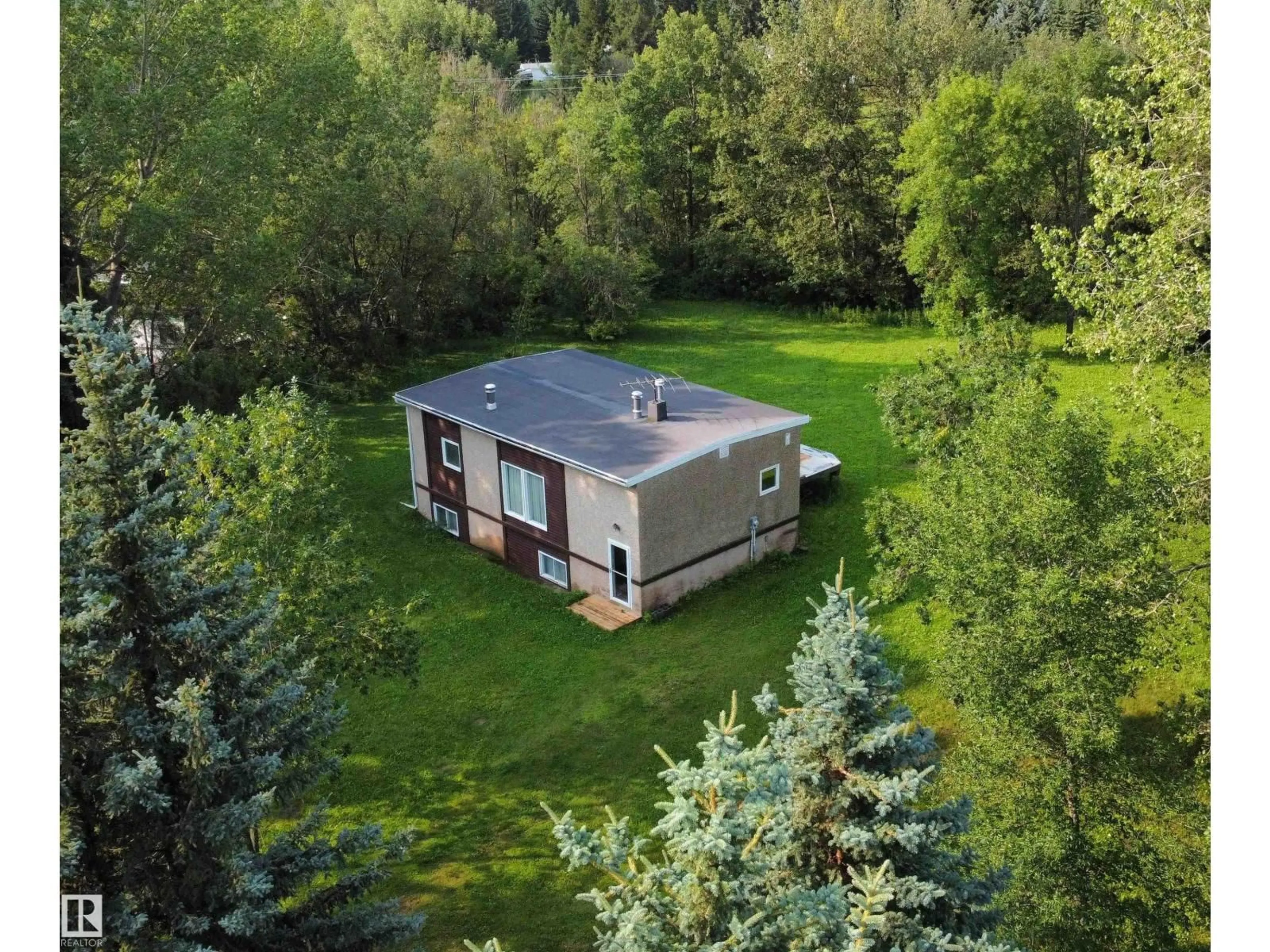 A pic from outside/outdoor area/front of a property/back of a property/a pic from drone, forest/trees view for 12 53220 RGE ROAD 15, Rural Parkland County Alberta T7Y0C3