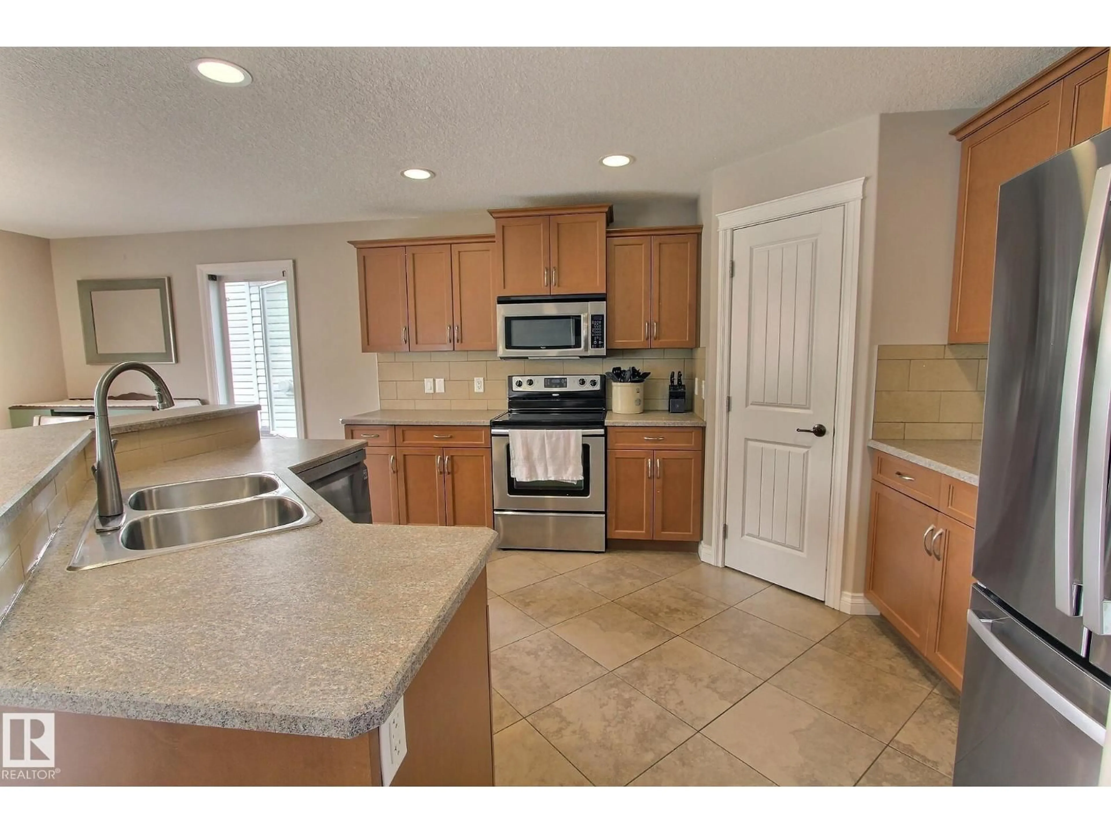 Open concept kitchen, ceramic/tile floor for 10 BIRCHMONT CR, Leduc Alberta T9E8S3