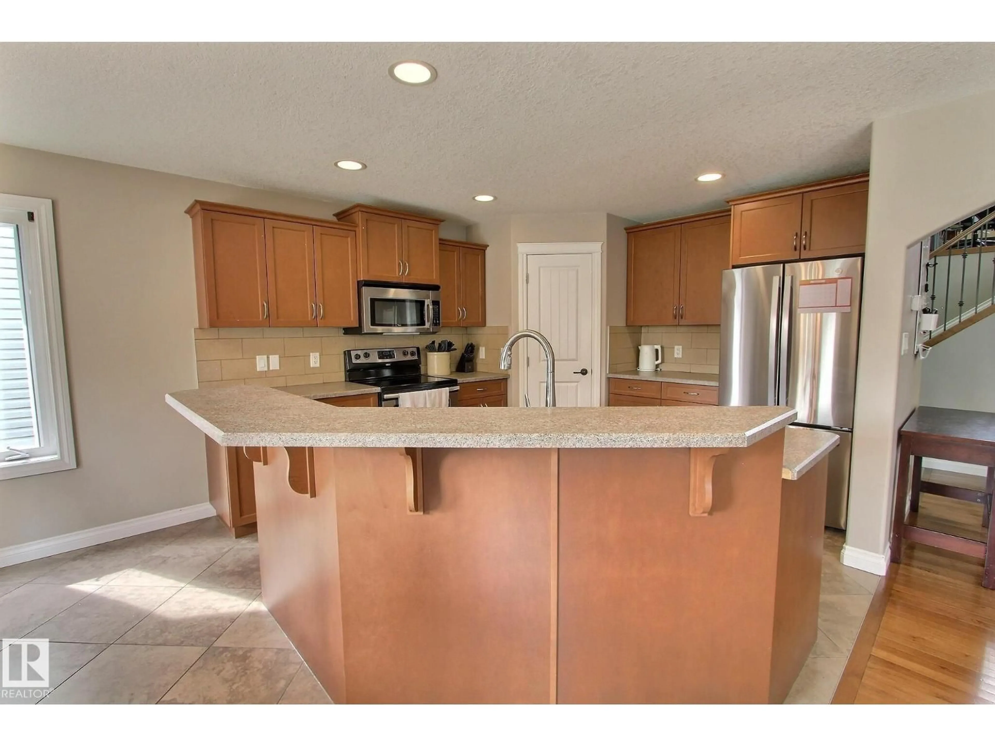 Open concept kitchen, ceramic/tile floor for 10 BIRCHMONT CR, Leduc Alberta T9E8S3