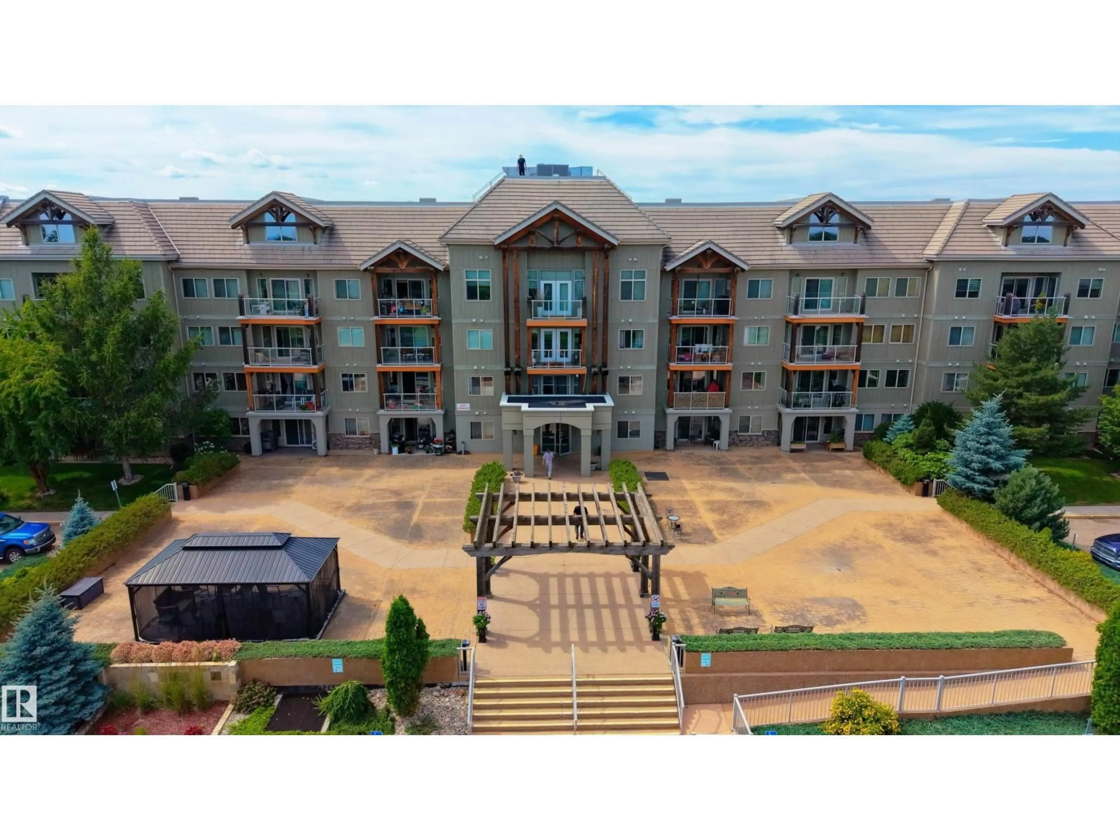 A pic from outside/outdoor area/front of a property/back of a property/a pic from drone, unknown for #211 - 278 SUDER GREENS DR, Edmonton Alberta T5T6V6