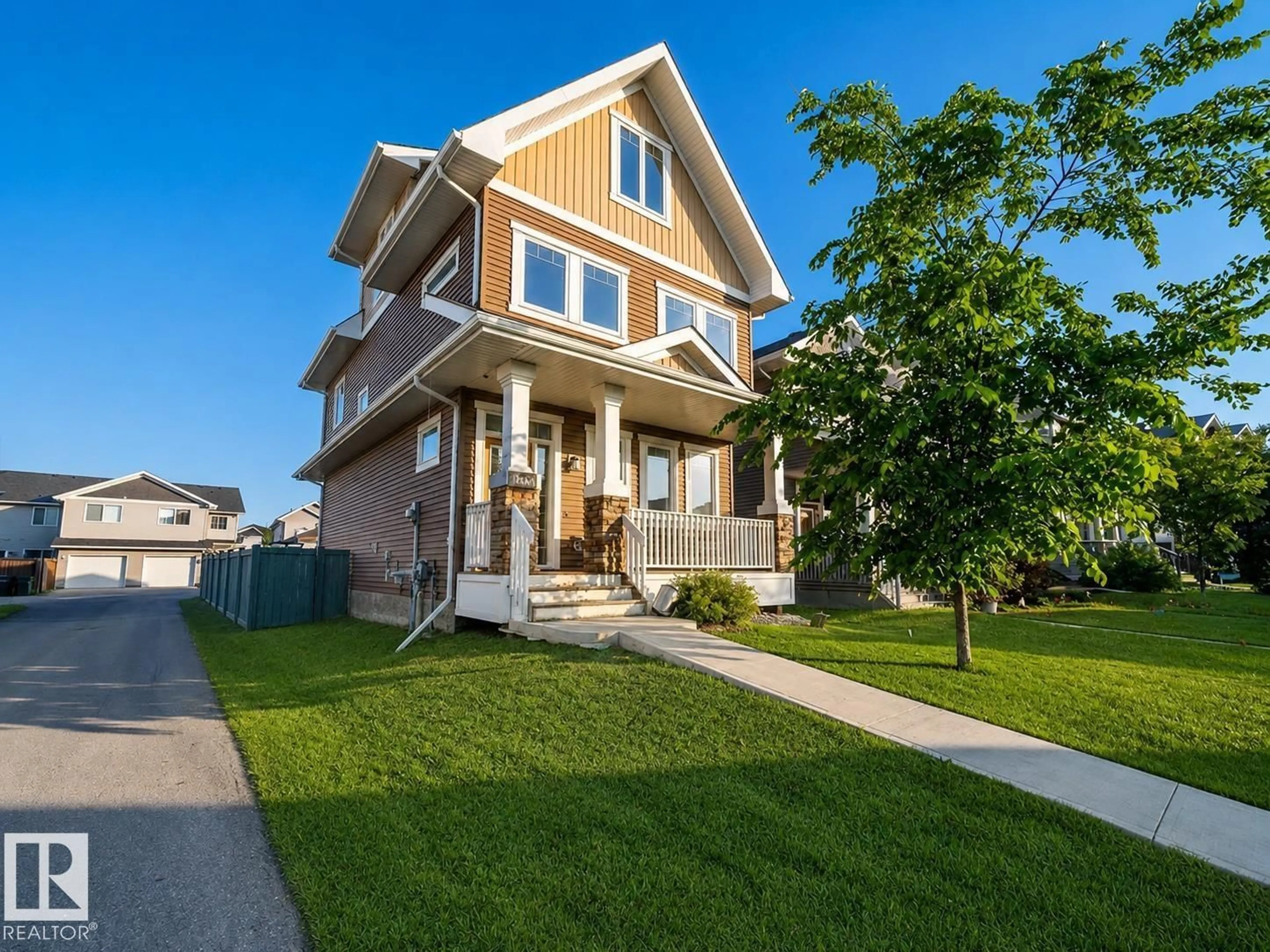 Home with vinyl exterior material, street for 16464 15 AV, Edmonton Alberta T6W2Z7