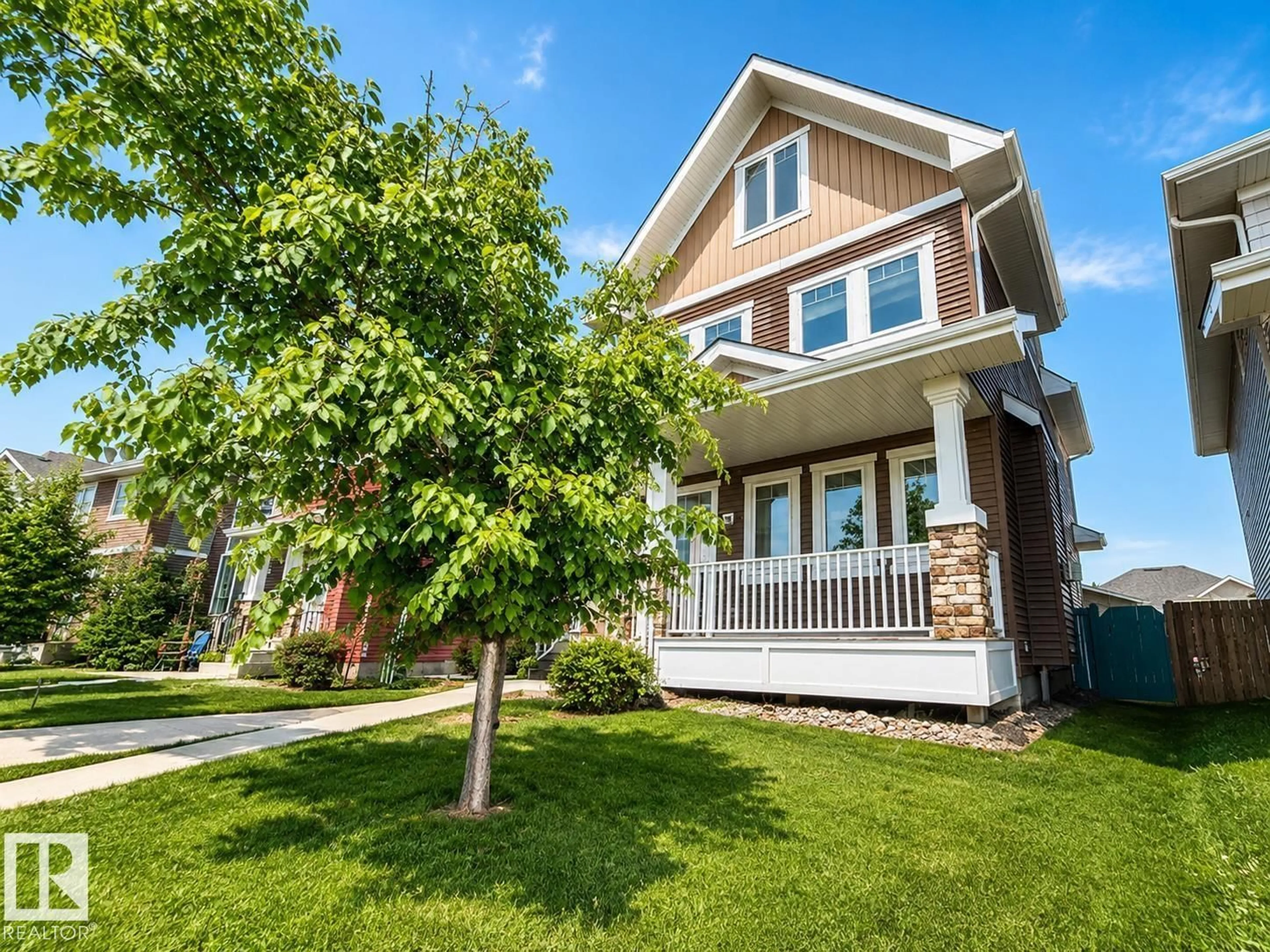 Home with vinyl exterior material, street for 16464 15 AV, Edmonton Alberta T6W2Z7