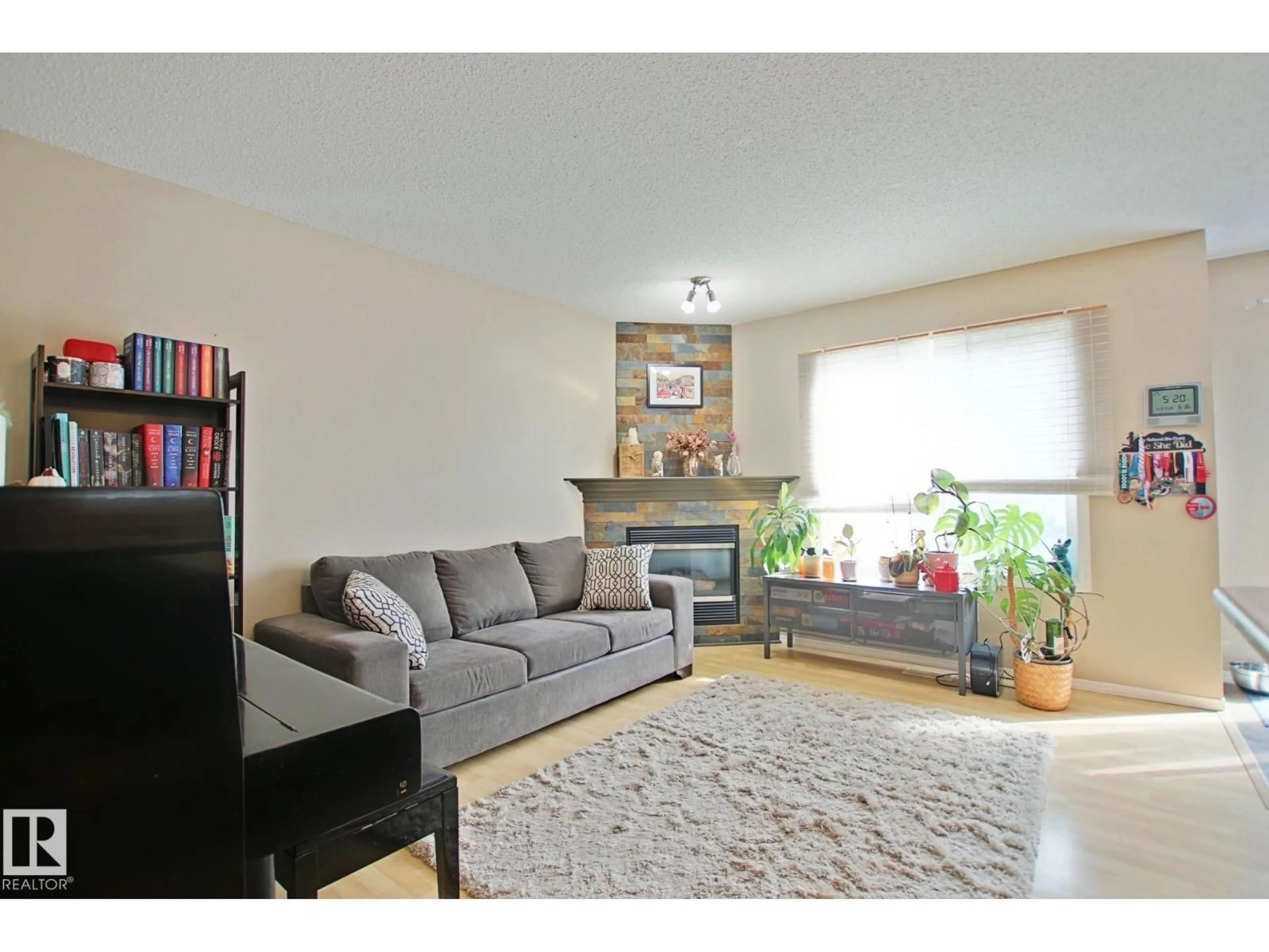 Living room with furniture, wood/laminate floor for #42 - 4350 23 ST NW, Edmonton Alberta T5T1X8