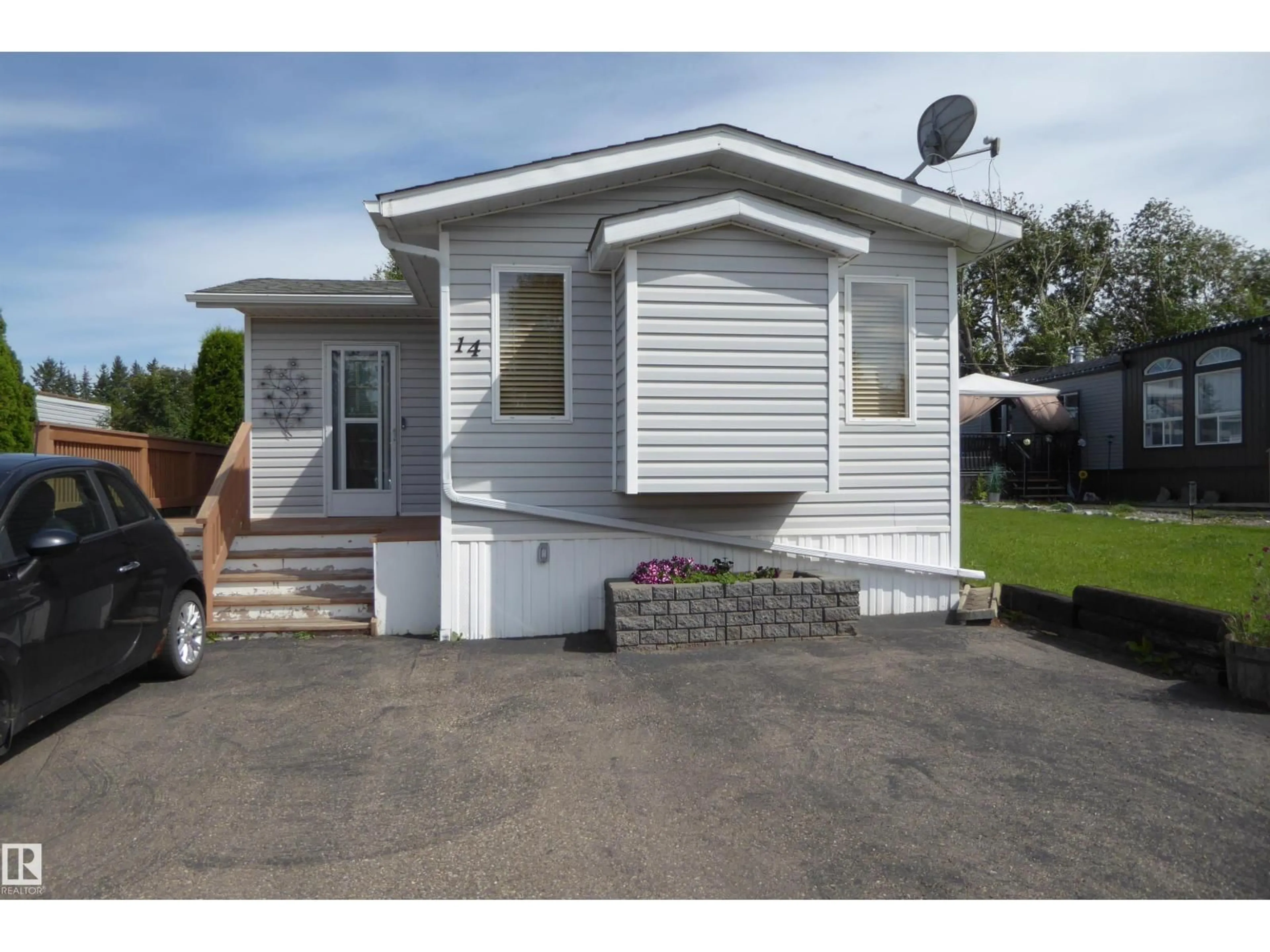Home with vinyl exterior material, street for 14 305 CALAHOO RD, Spruce Grove Alberta T7X3K5