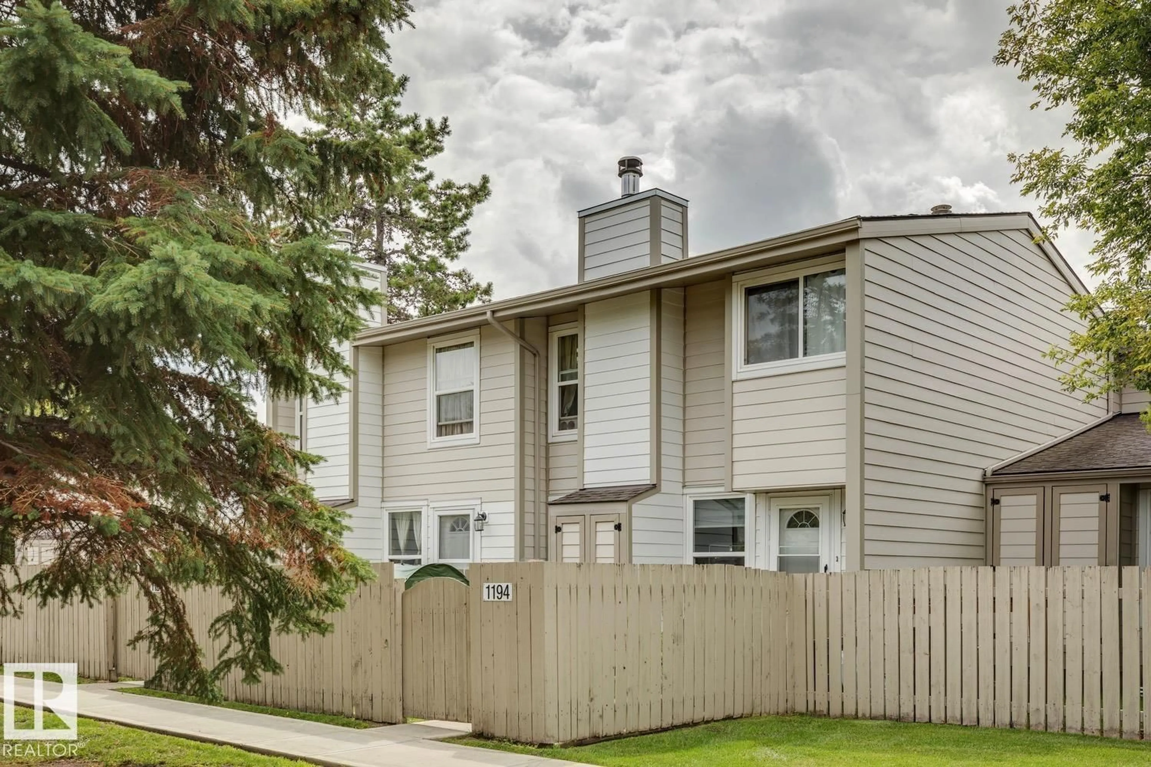Home with vinyl exterior material, street for 1194 KNOTTWOOD RD, Edmonton Alberta T6K2J8
