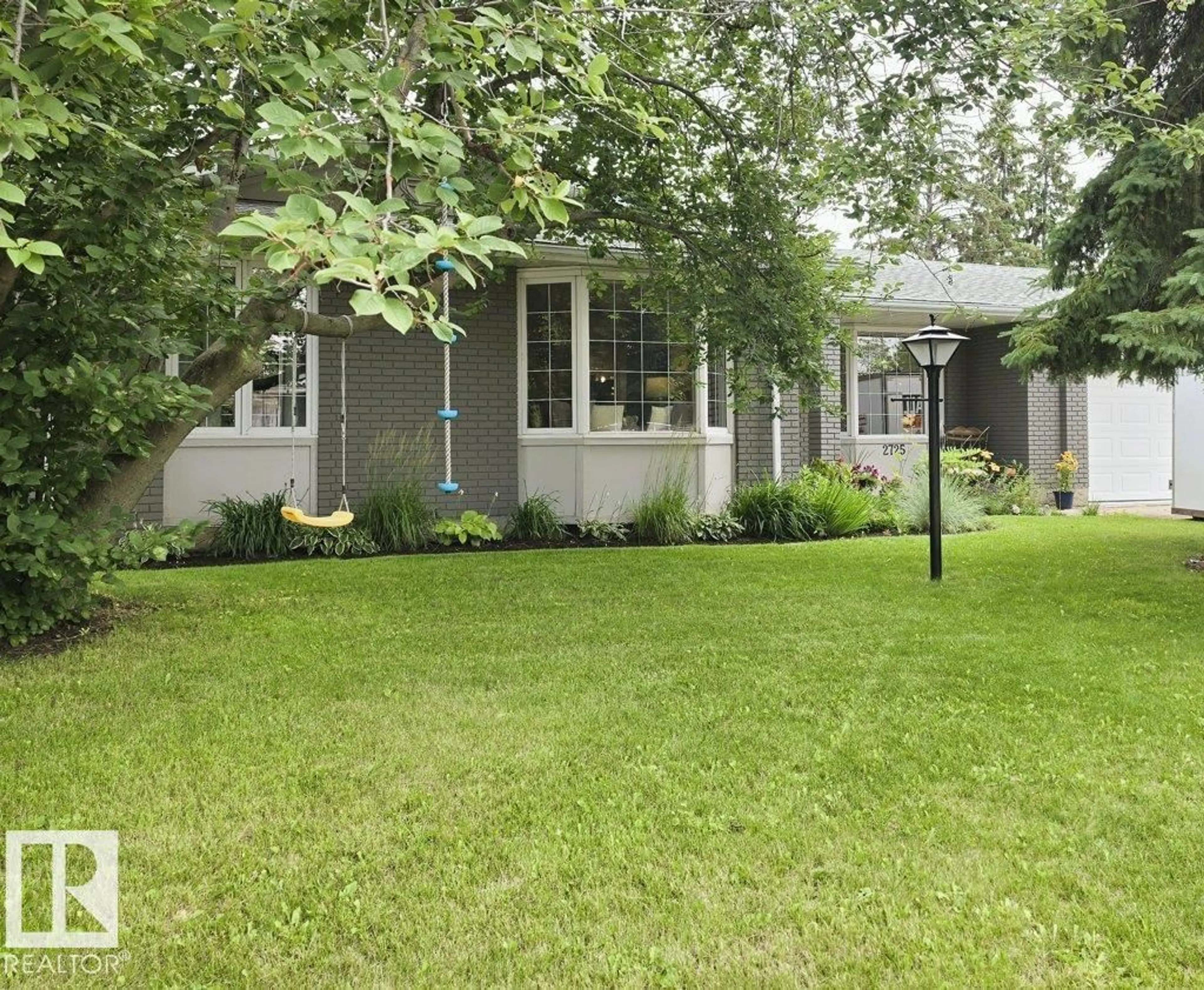 Home with vinyl exterior material, street for 2725 104A ST NW, Edmonton Alberta T6J4C4