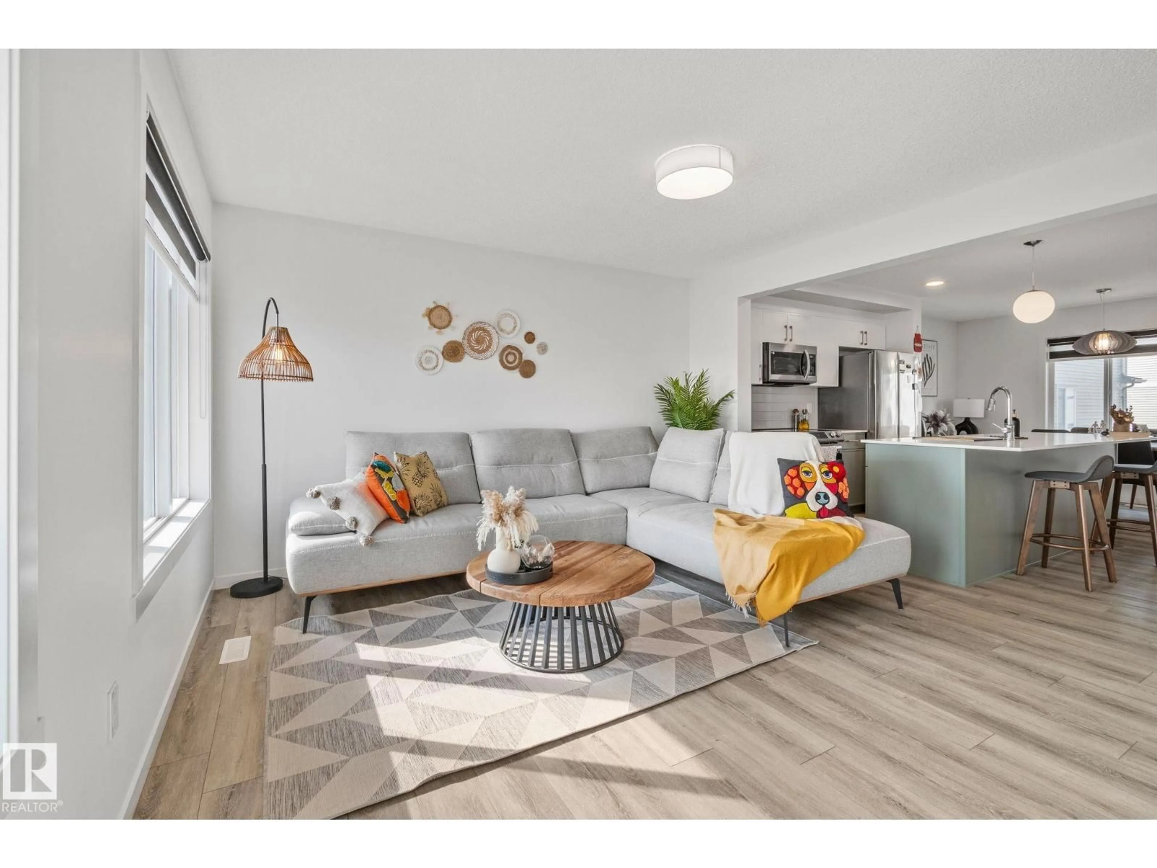 Living room with furniture, wood/laminate floor for 1530 - 60A TAMARACK BV, Edmonton Alberta T6T2E6