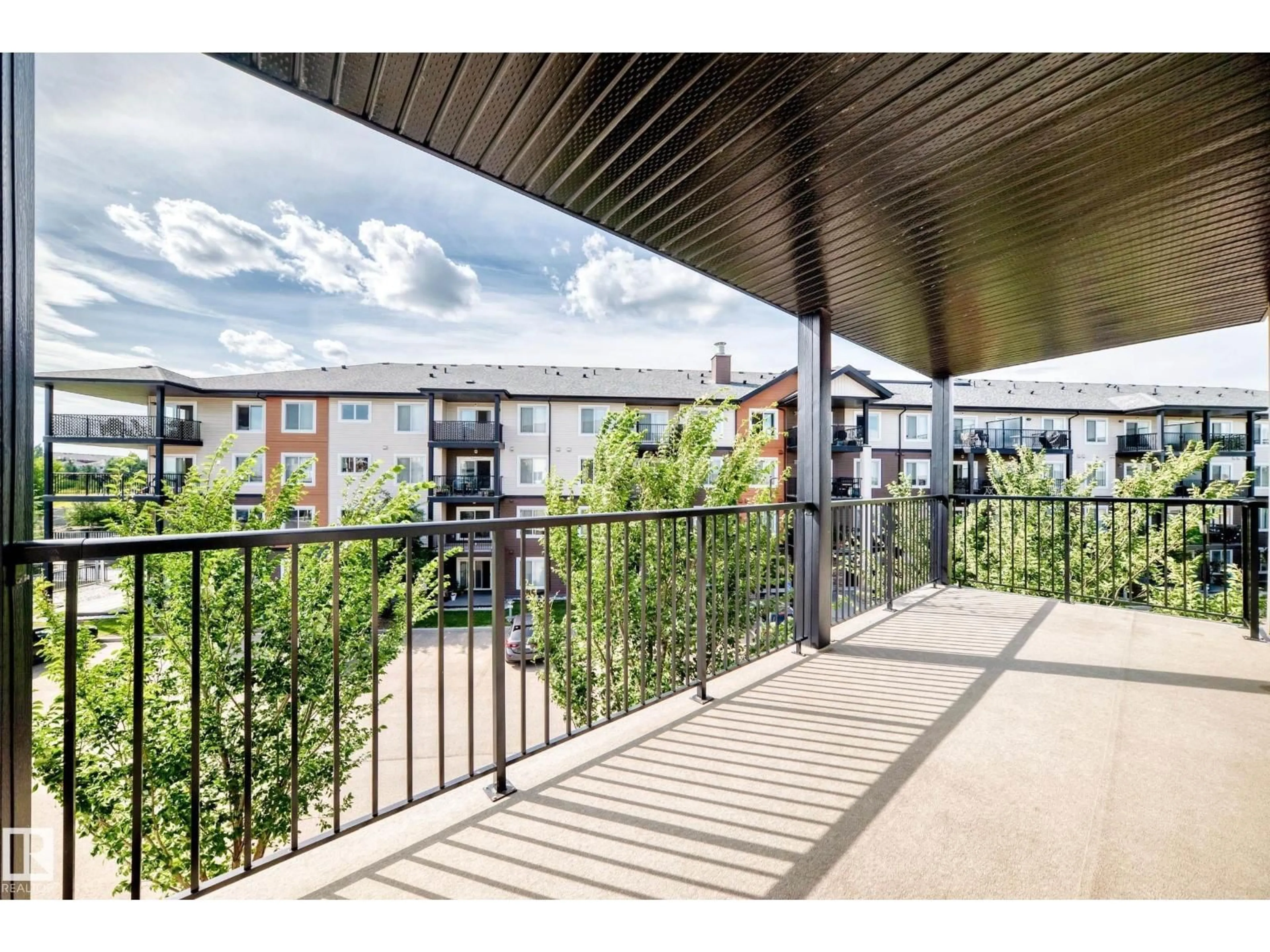 Patio, city buildings view from balcony for 322 EBBERS BV, Edmonton Alberta T5Y3W2