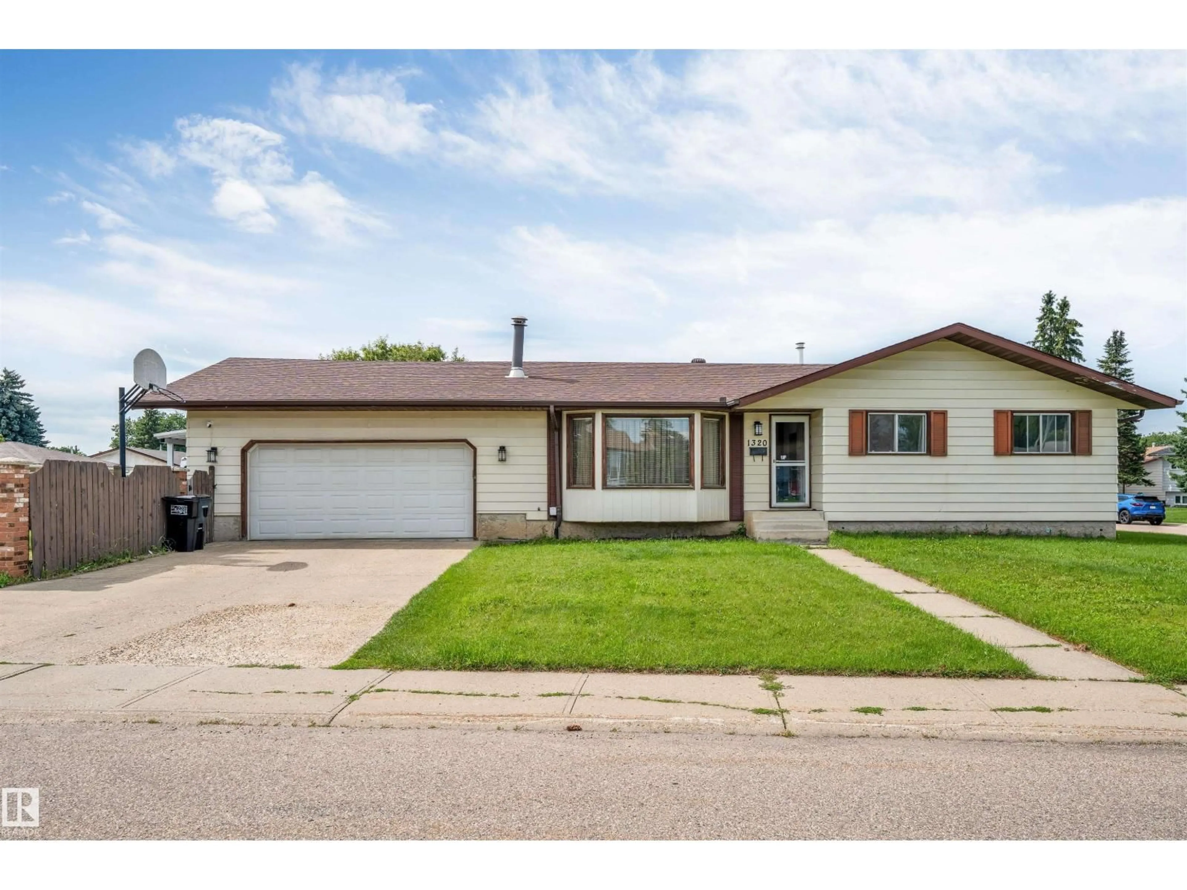 Home with vinyl exterior material, street for 1320 69 ST, Edmonton Alberta T6K3K6