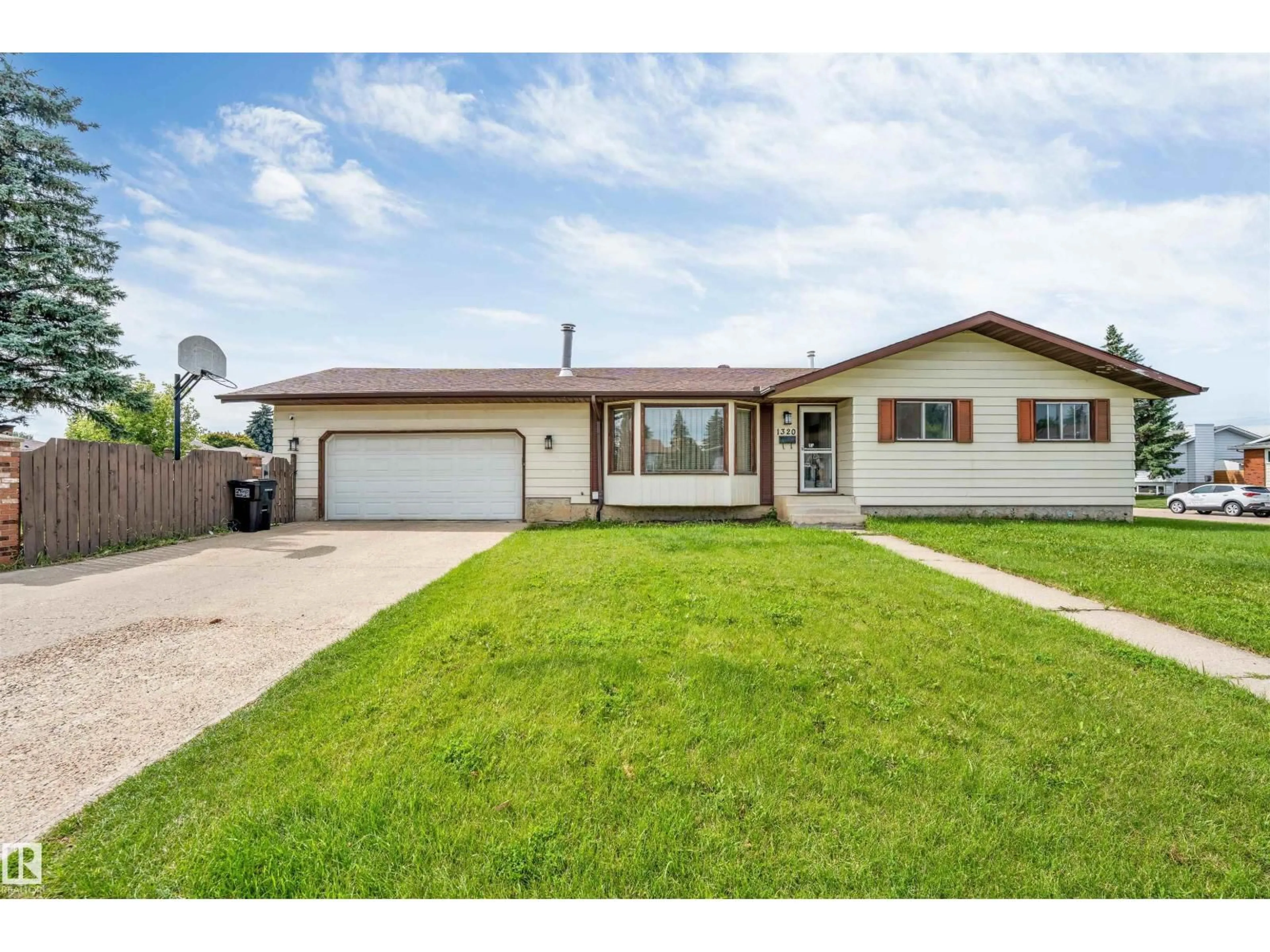 Home with vinyl exterior material, street for 1320 69 ST, Edmonton Alberta T6K3K6