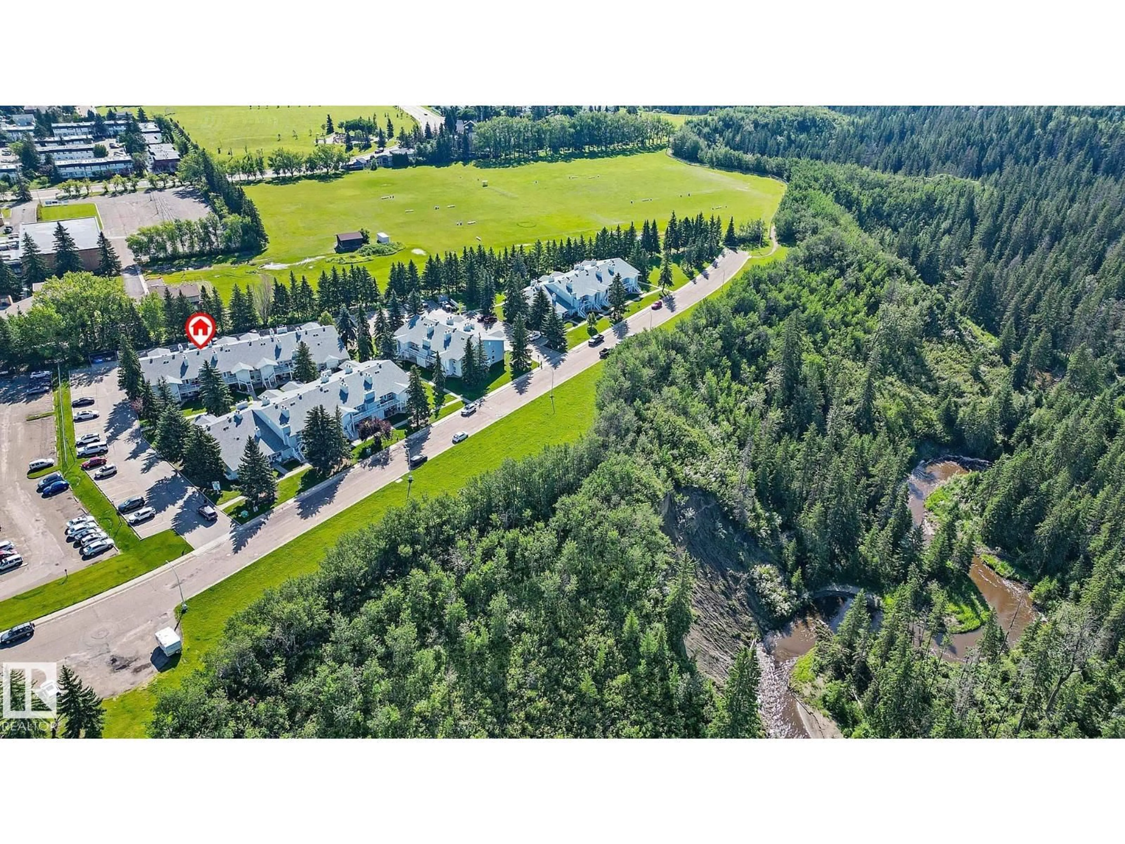 A pic from outside/outdoor area/front of a property/back of a property/a pic from drone, forest/trees view for 29 2115 118 ST NW, Edmonton Alberta T6J5N1