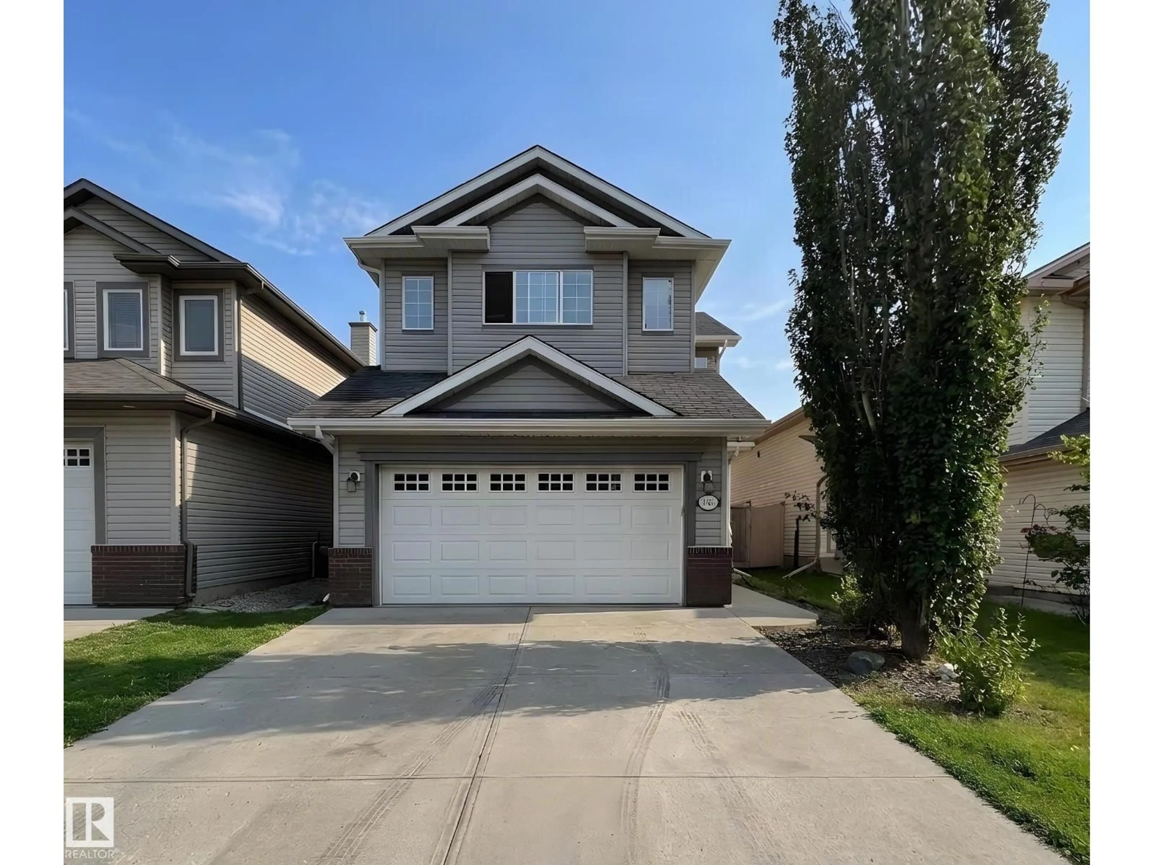Home with vinyl exterior material, street for 11407 167A AV, Edmonton Alberta T5X0A7
