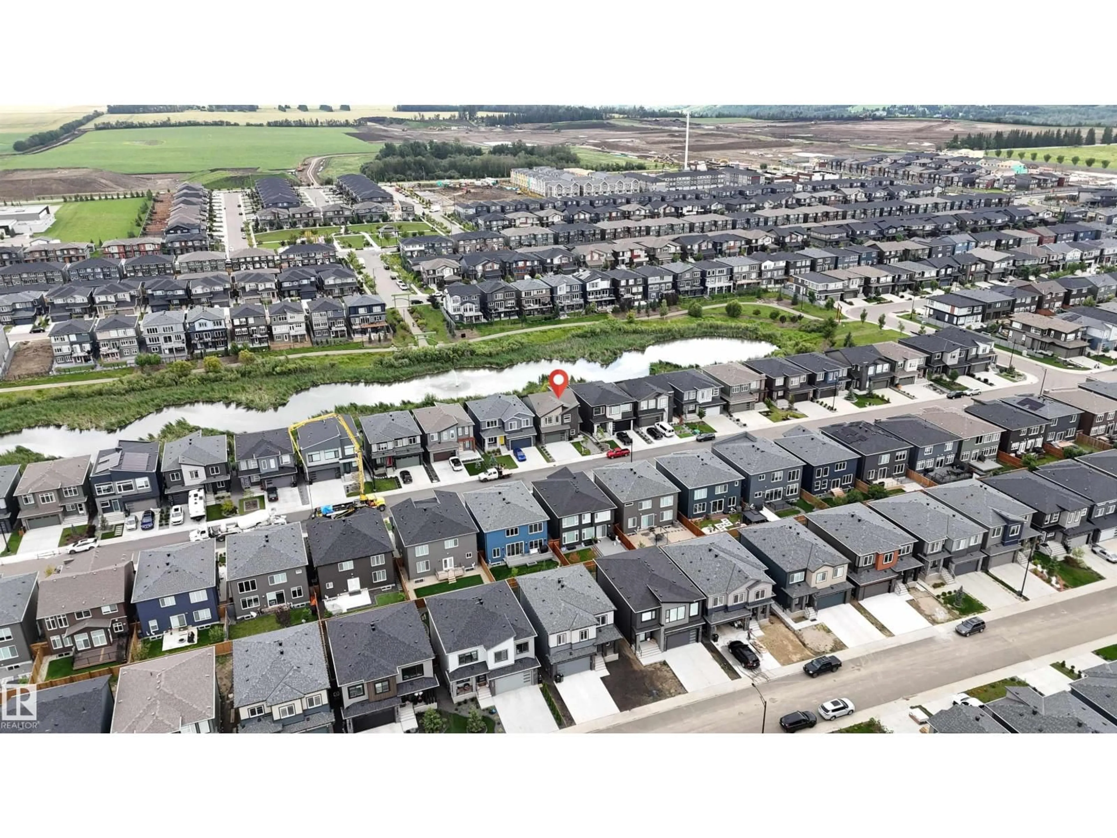 A pic from outside/outdoor area/front of a property/back of a property/a pic from drone, street for SW - 6045 KING LANDING LD, Edmonton Alberta T6W4Z7