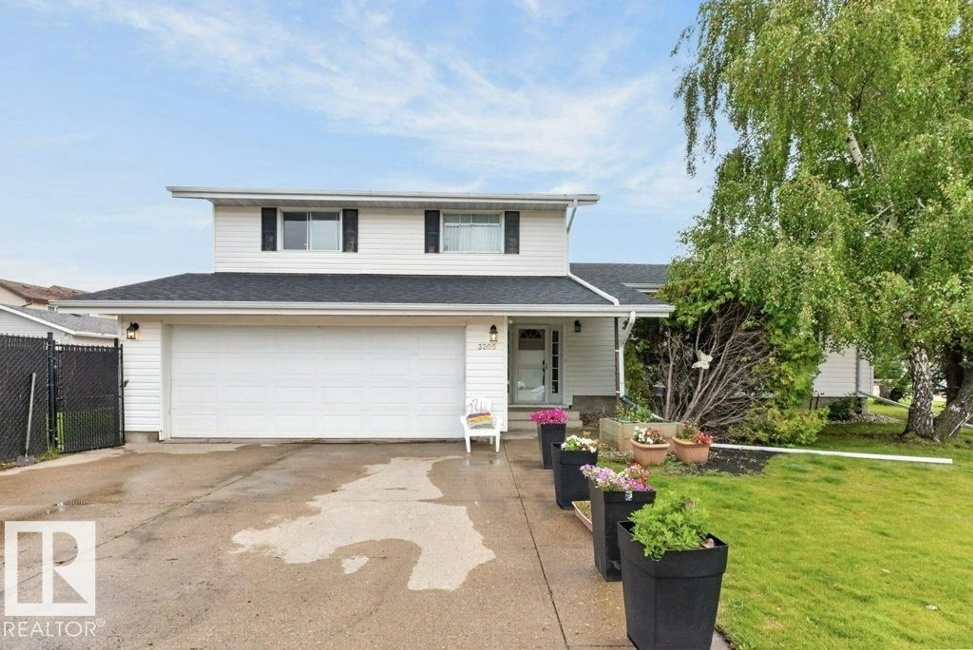 Home with vinyl exterior material, street for NW - 3205 104A ST, Edmonton Alberta T6J4H7