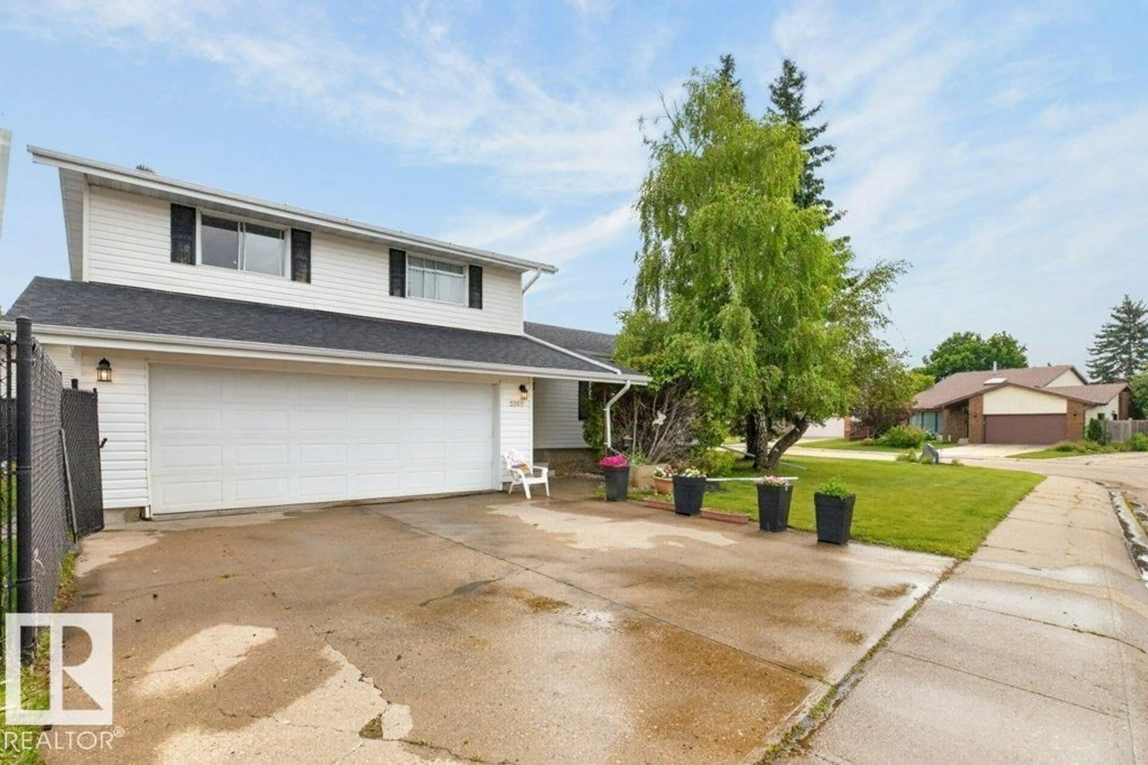 Home with vinyl exterior material, street for NW - 3205 104A ST, Edmonton Alberta T6J4H7