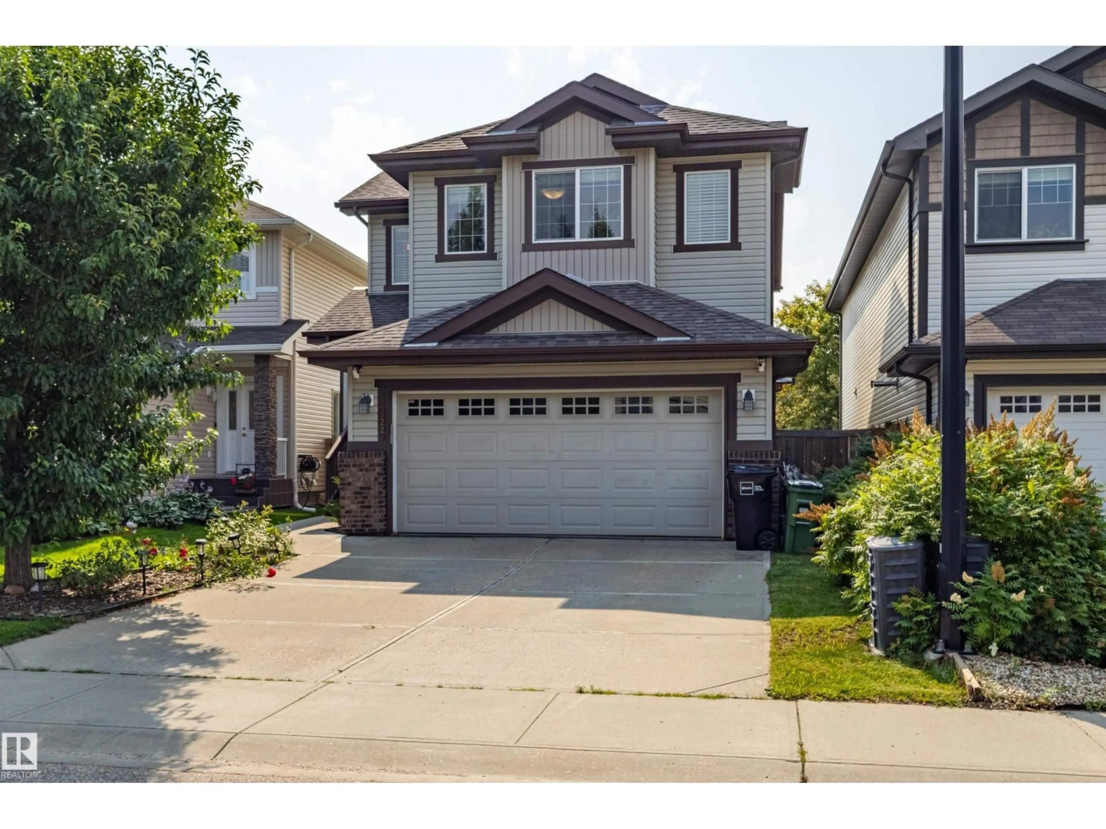 Home with vinyl exterior material, street for SW - 522 174A ST, Edmonton Alberta T6W2A6
