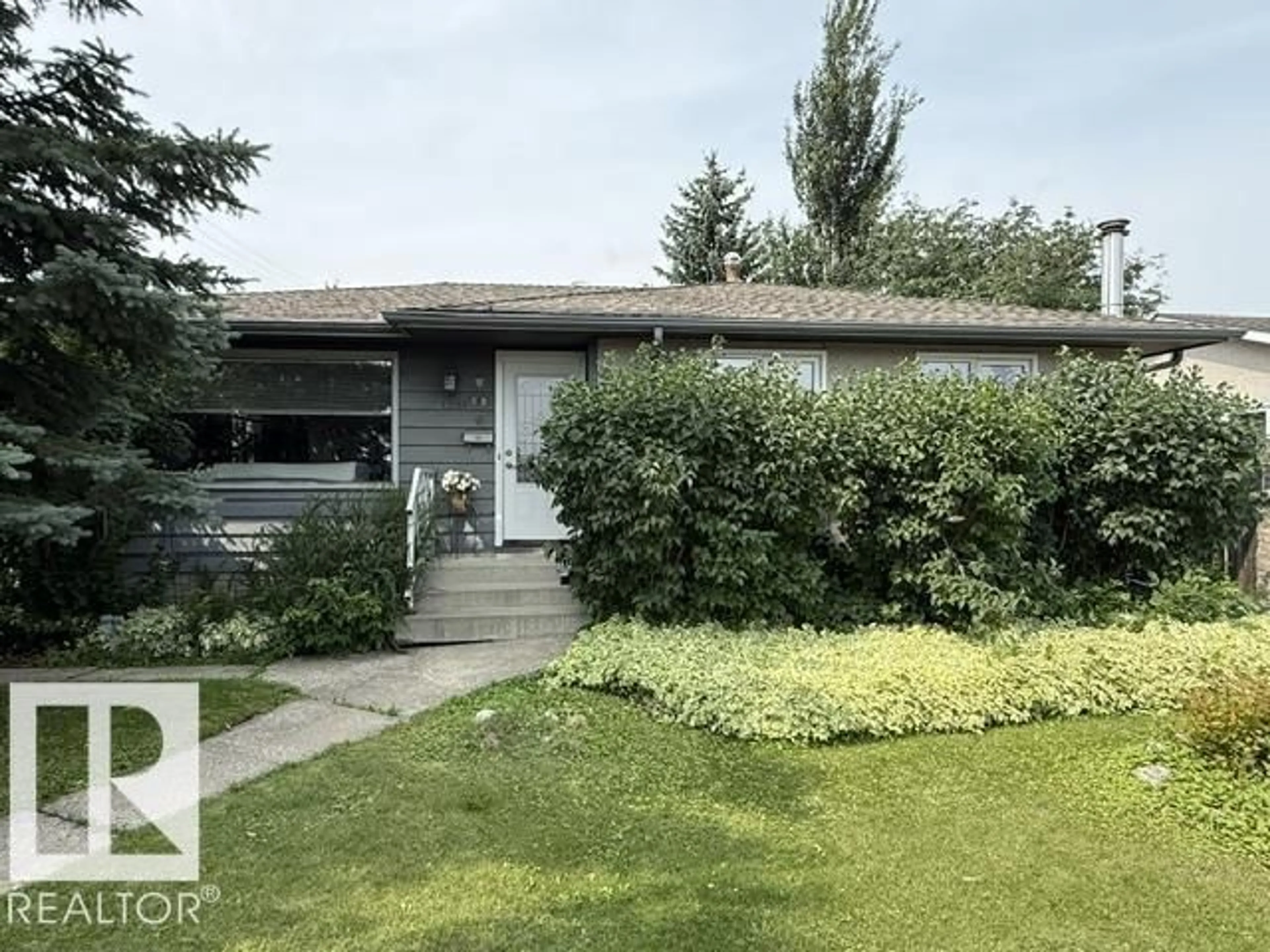 Home with vinyl exterior material, street for NW - 13508 64 ST, Edmonton Alberta T5A0Y9