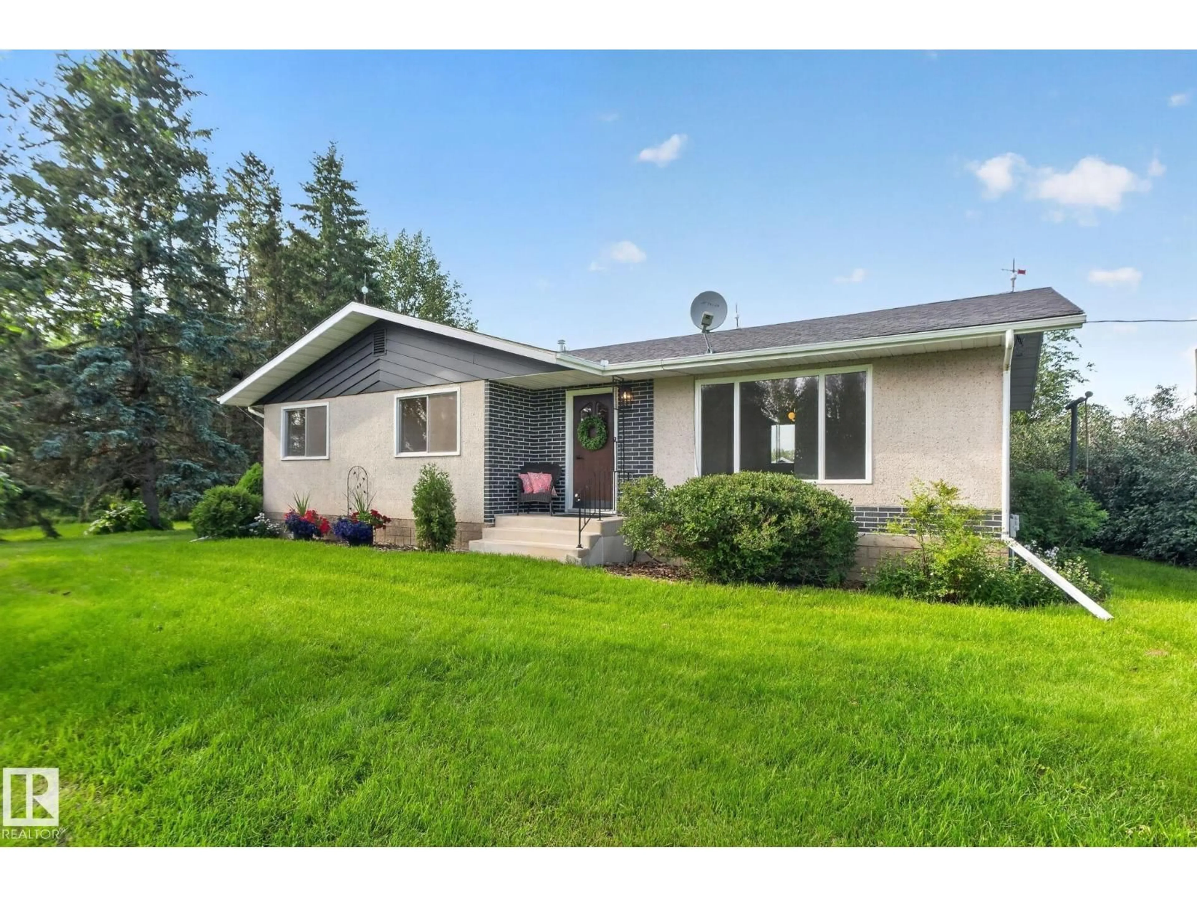 Home with vinyl exterior material, street for 58201 RR 214, Rural Thorhild County Alberta T0A2W0